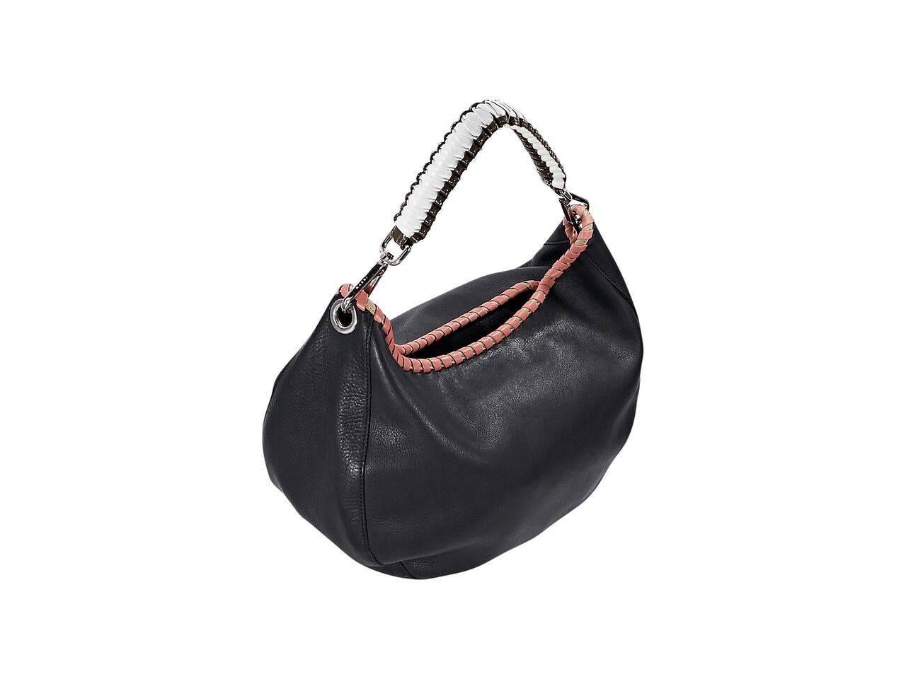 Product details:  Black leather hobo bag by Marni.  Accented with pink whipstitched trim.  Single shoulder strap.  Concealed double snap closure.  Lined interior.  Silvertone hardware.  13