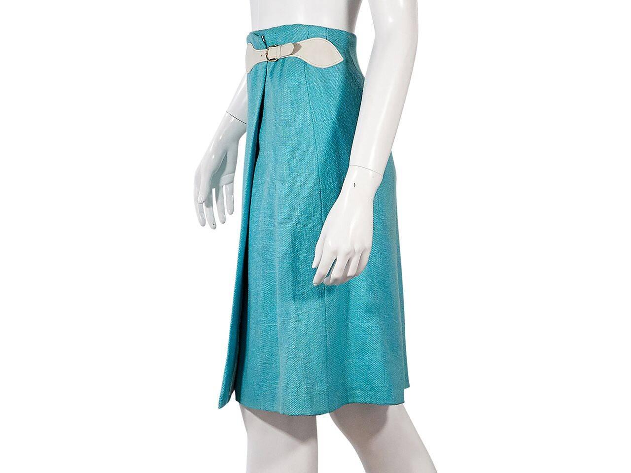 Product details:  Vintage teal blue wrap skirt by Hermès.  Side buckle strap closure.  Label size FR 38. 
Condition: Pre-owned. Very good.
Est. Retail $ 998.00
