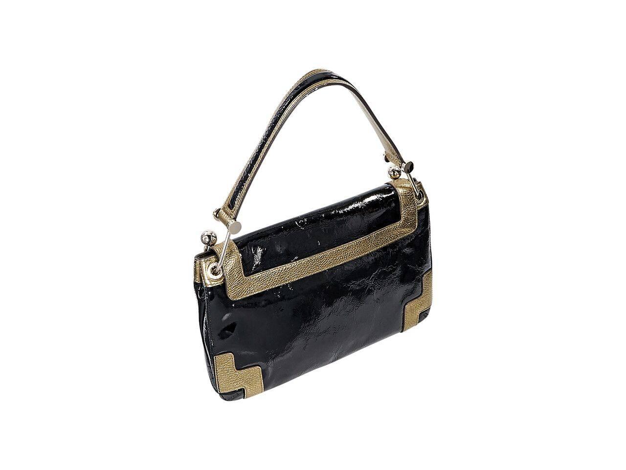 Product details:  Black patent leather Lautner shoulder bag by Anya Hindmarch.  Trimmed with gold leather.  Single shoulder strap.  Front flap.  Lined interior with inner zip and slide pockets plus a pen slot.  Goldtone hardware.  14"L x