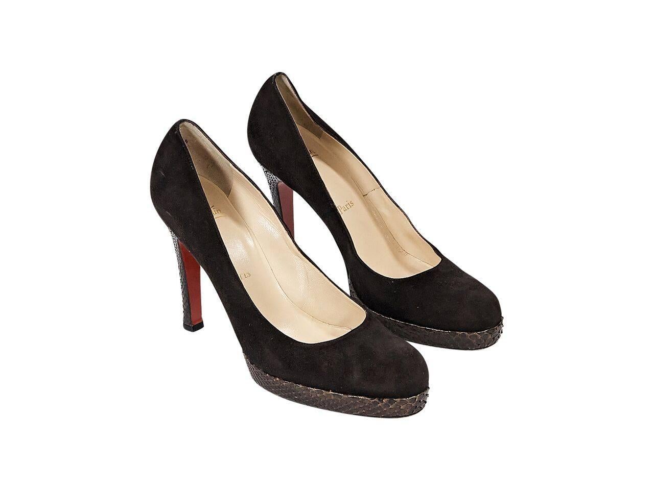 Product details:  Brown suede platform pumps by Christian Louboutin.  Trimmed with python skin.  Round toe.  Iconic red sole.  Slip-on style. 
Condition: Pre-owned. Very good.  
Est. Retail $ 1,300.00