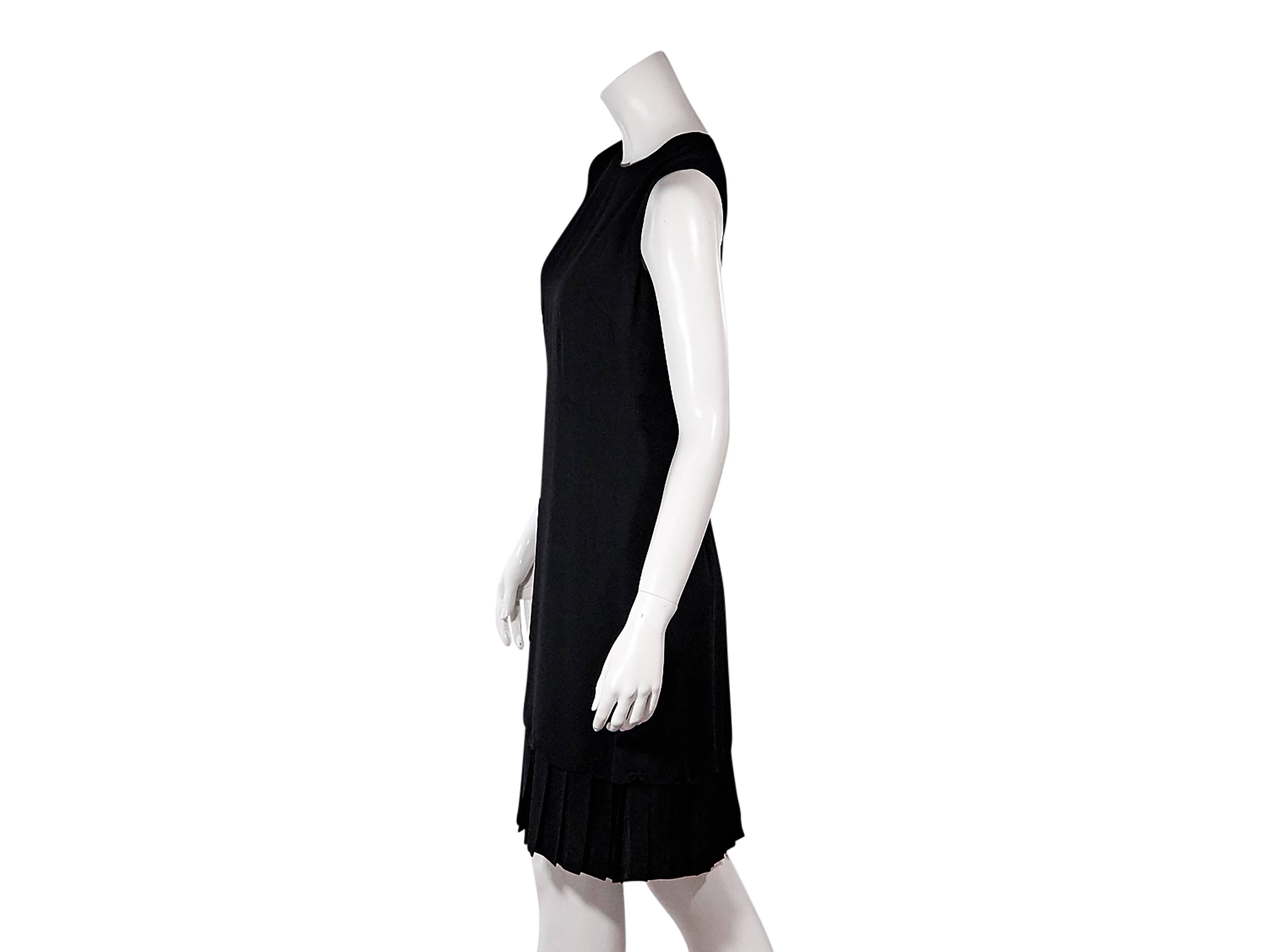 Product details:  Black sheath dress by Prada.  Jewelneck.  Sleeveless.  Concealed back zip closure.  Pleated hem. Size 6/8
Condition: Pre-owned. Very good.

Est. Retail $ 1,800.00