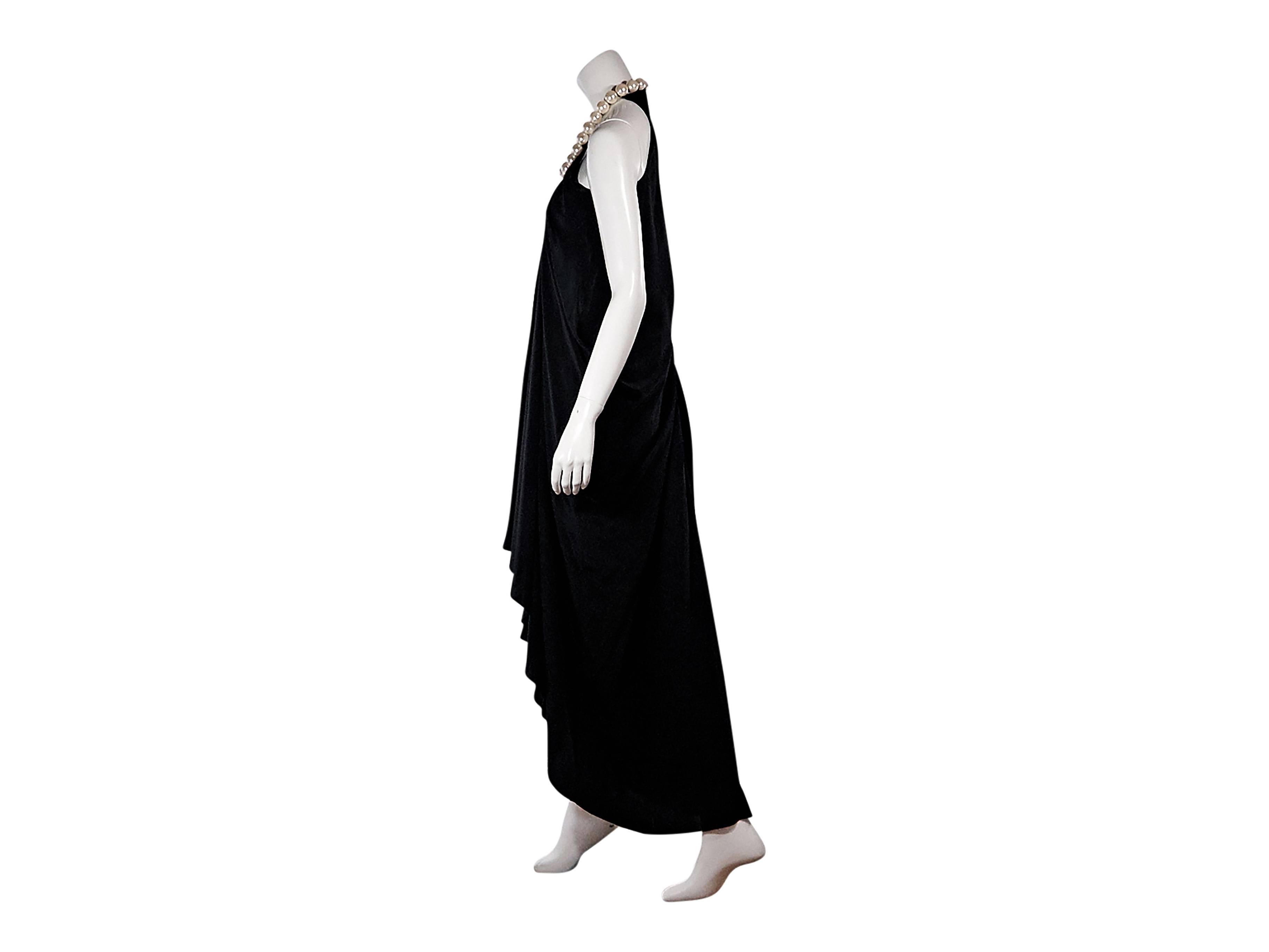 Product details:  Black draped maxi dress by Issa London.  Sleeveless.  Faux pearl halterneck.  Concealed side zip closure.  High-low hem. Size 6
Condition: Pre-owned. New with tags.

Est. Retail $ 595.00
