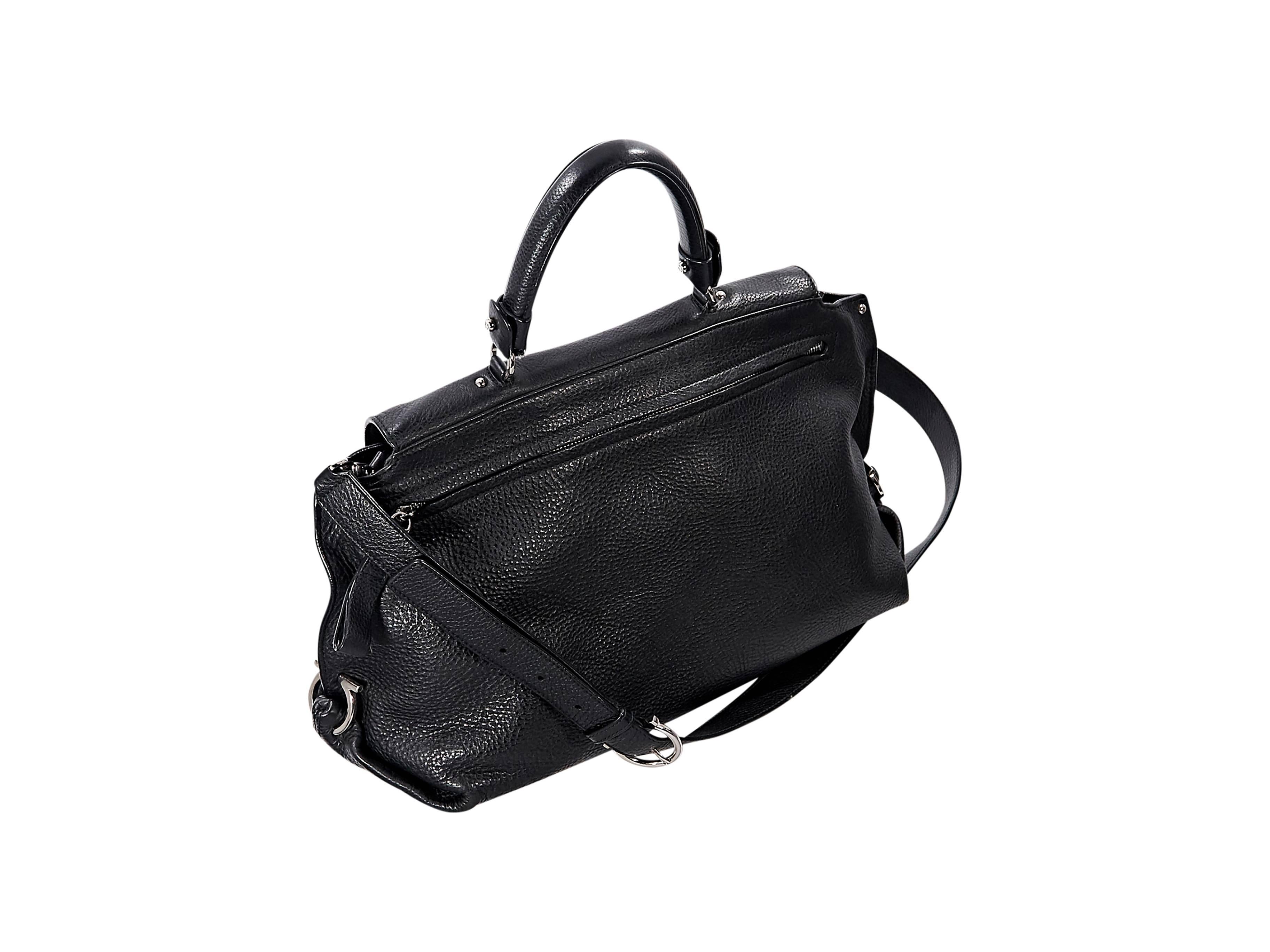 Product details:  Black medium leather Sophia satchel by Salvatore Ferragamo.  Top handle.  Detachable, adjustable shoulder strap.  Flip-lock closure.  Zip closure under front flap.  Lined interior with inner zip pocket.  Back exterior zip pocket. 