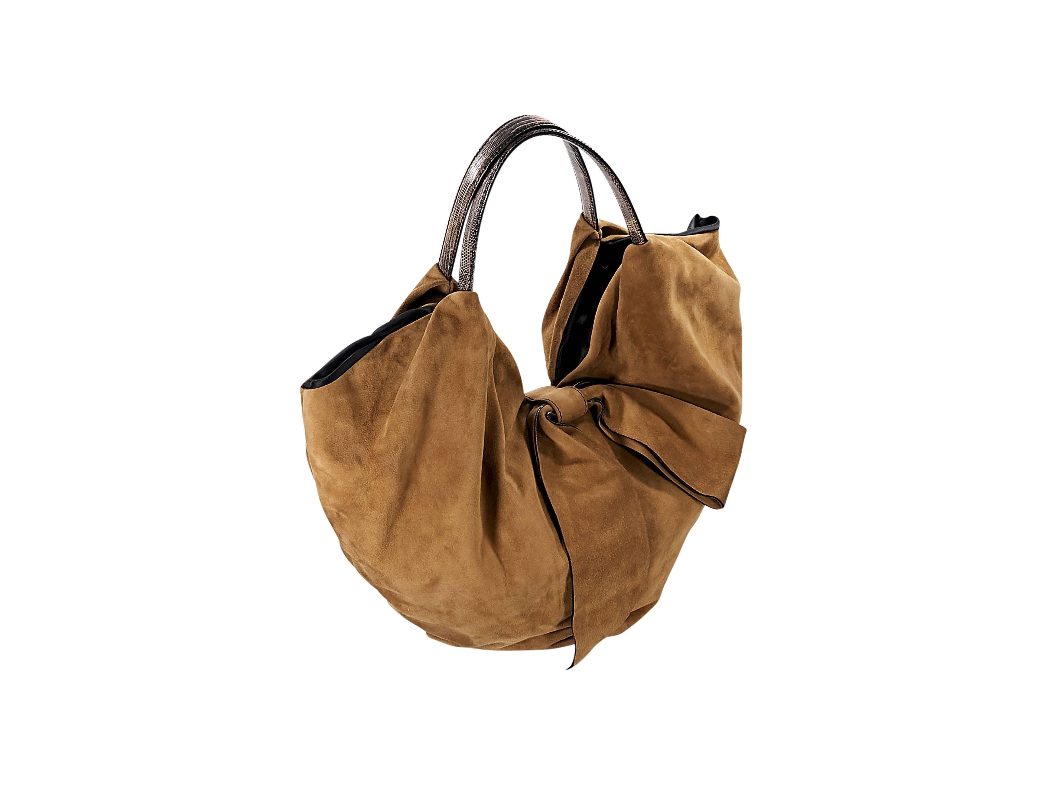 Product details:  Tan suede 360 hobo bag by Valentino.  Dual shoulder straps.  Top magnetic tab closure.  Lined interior with inner zip and slide pockets.  Goldtone hardware.  21