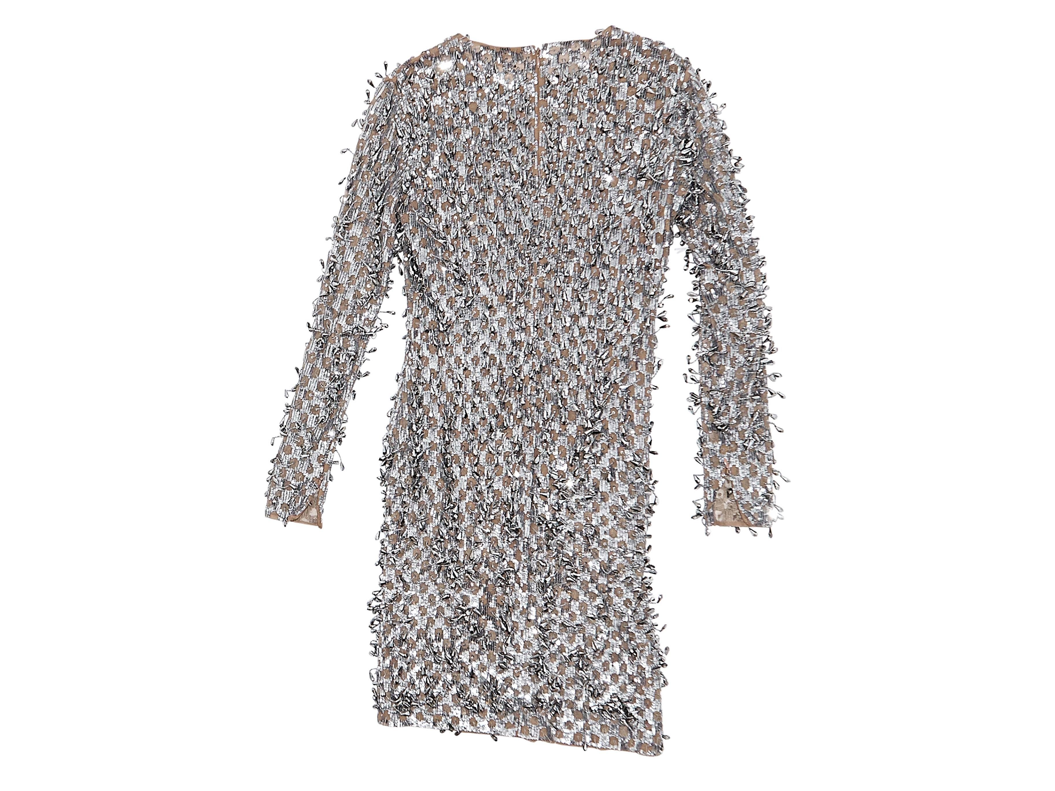 Product details:  Silver sequin embellished dress by Michael Kors.  From the 2016 runway collection.  Jewelneck.  Long sleeves.  Concealed back zip closure.  Nude mesh lining with inner attached bodysuit. Size 4
Condition: Pre-owned. Very