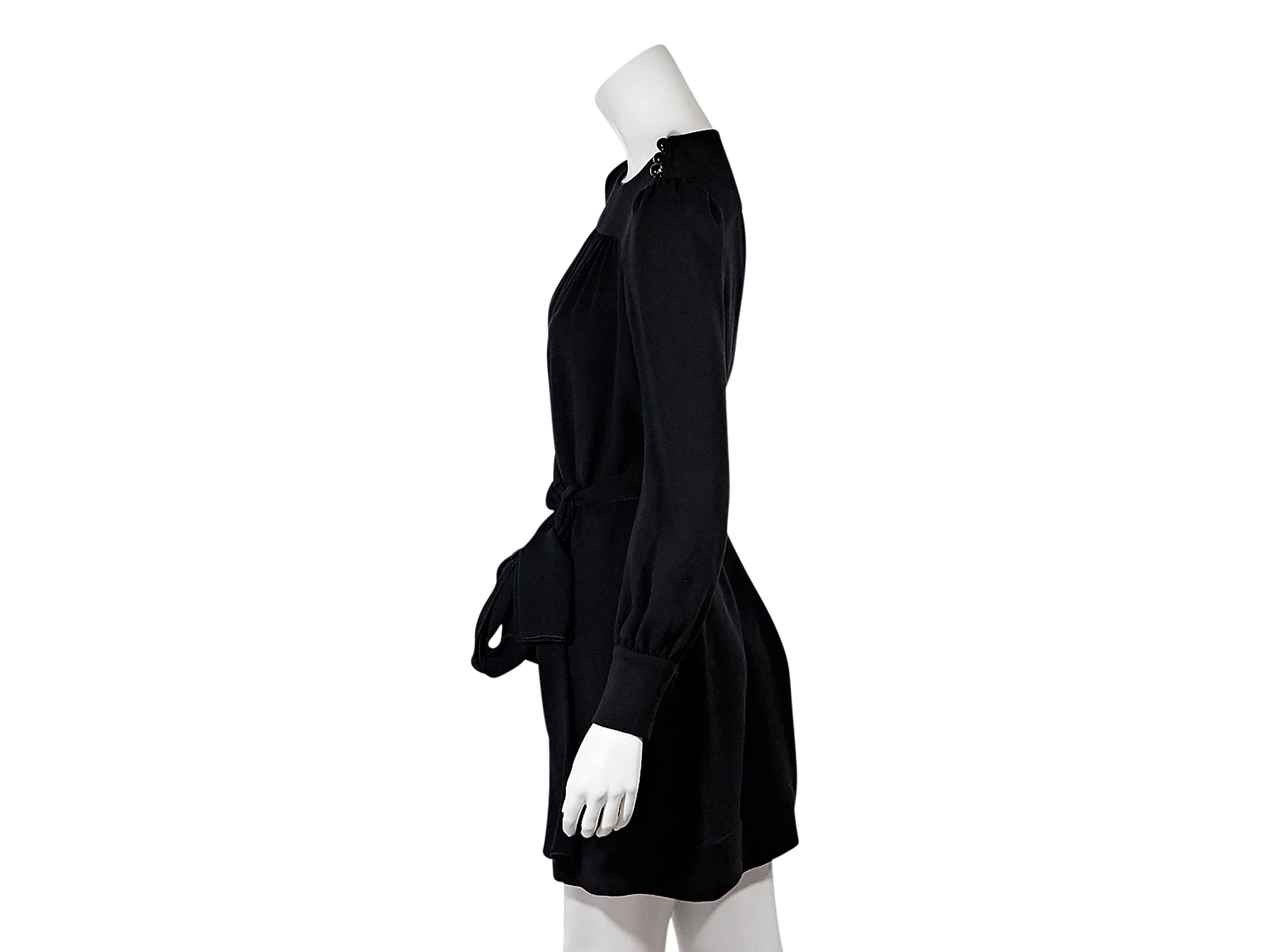 Product details:  Black belted dress by Prada.  Crewneck.  Long sleeves.  Three-button detail at shoulders and cuffs.  Self-tie belted waist.  Concealed side zip closure. Size 0
Condition: Pre-owned. Very good.

Est. Retail $ 1,100.00