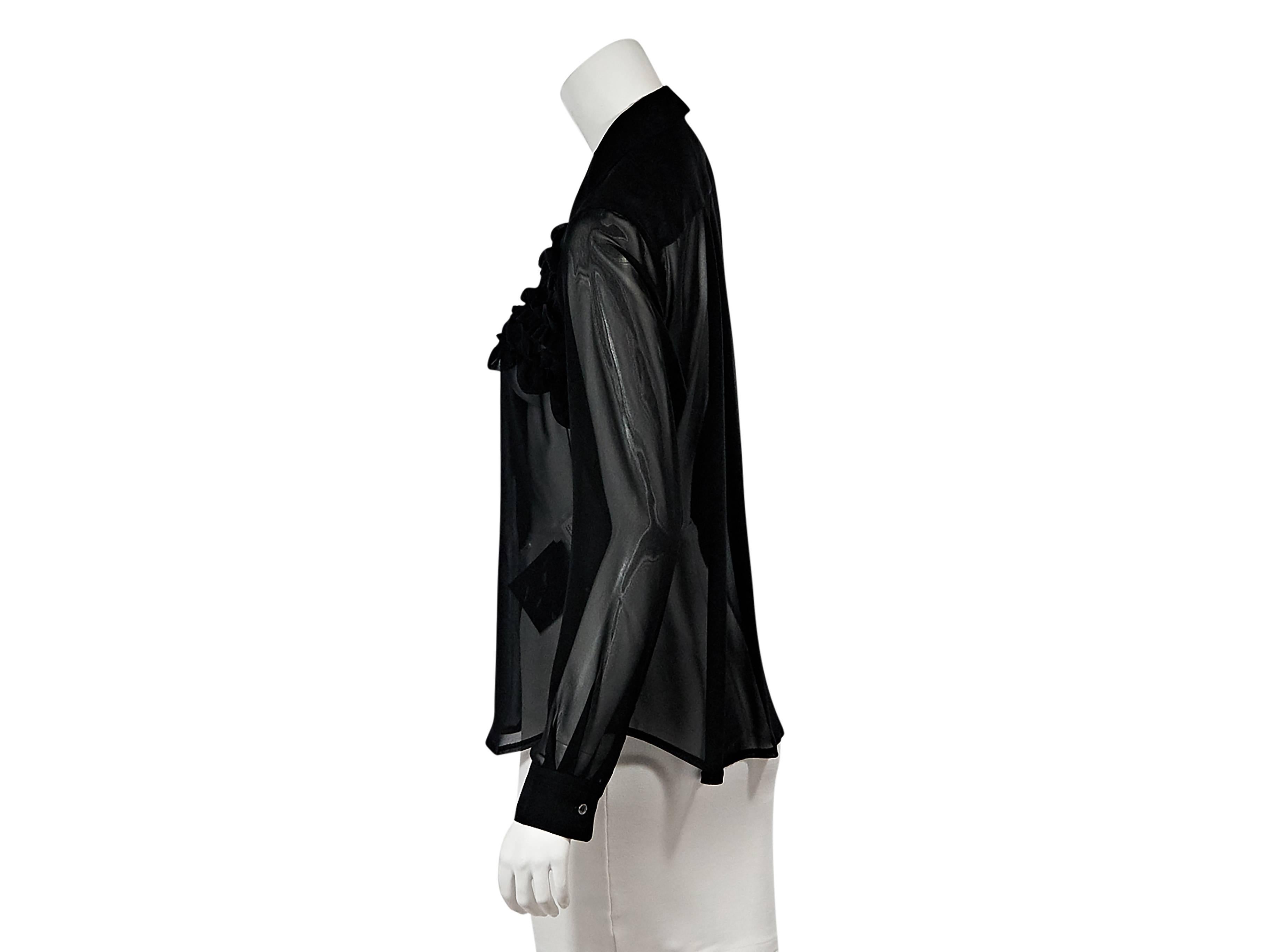 Product details:  Black sheer ruffle-trimmed blouse by Comme des Garcons.  Peter pan collar.  Button-front closure.  Single button closure.  Size L
Condition: Pre-owned. New with tags.

Est. Retail $ 1,245.00
