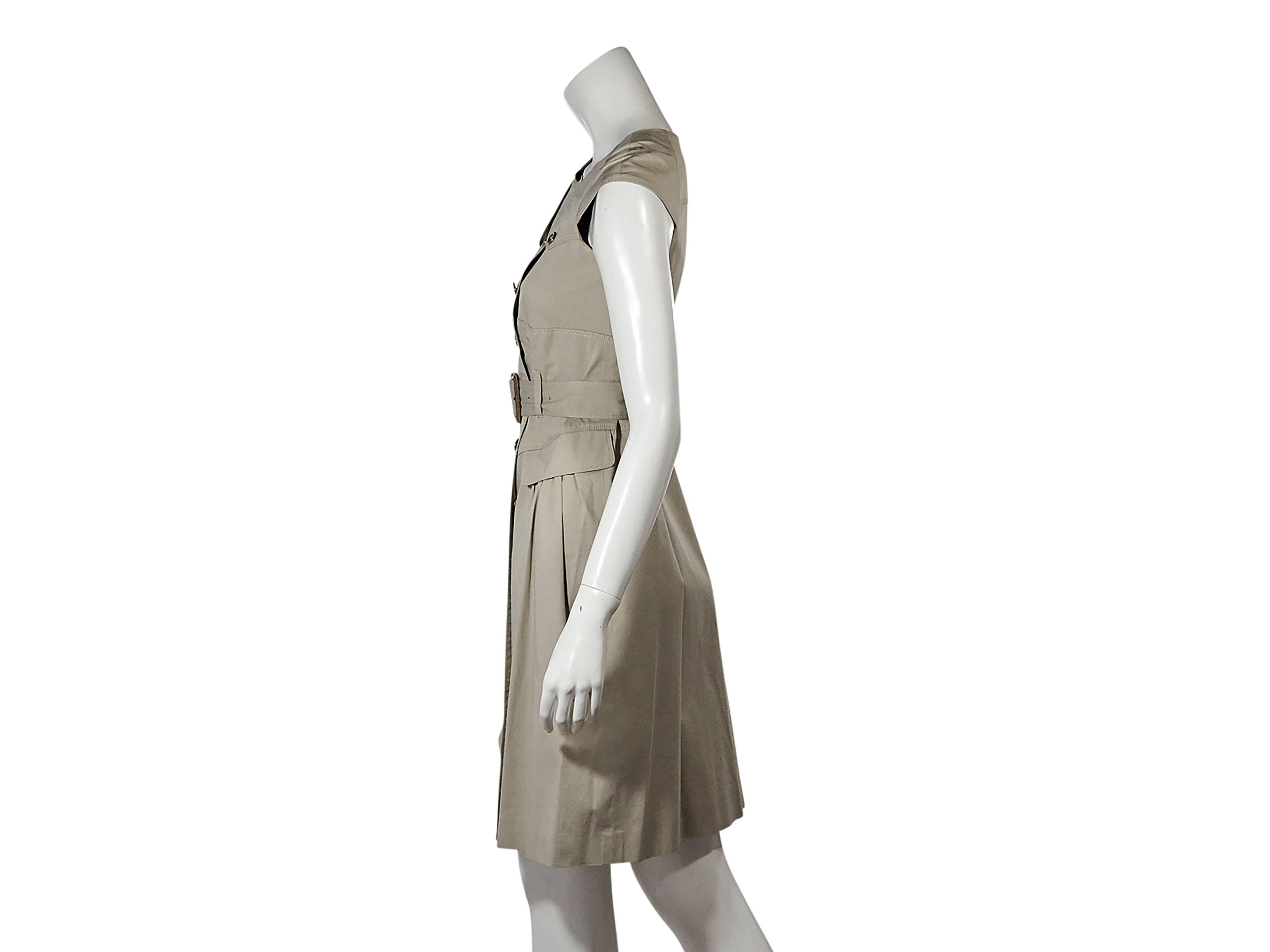 Product details:  Tan trench-style dress by Burberry London.  Jewelneck.  Cap sleeves.  Double-breasted button front.  Adjustable belted waist.  Waist flap pockets. Size 4
Condition: Pre-owned. Very good.

Est. Retail $ 989.00
