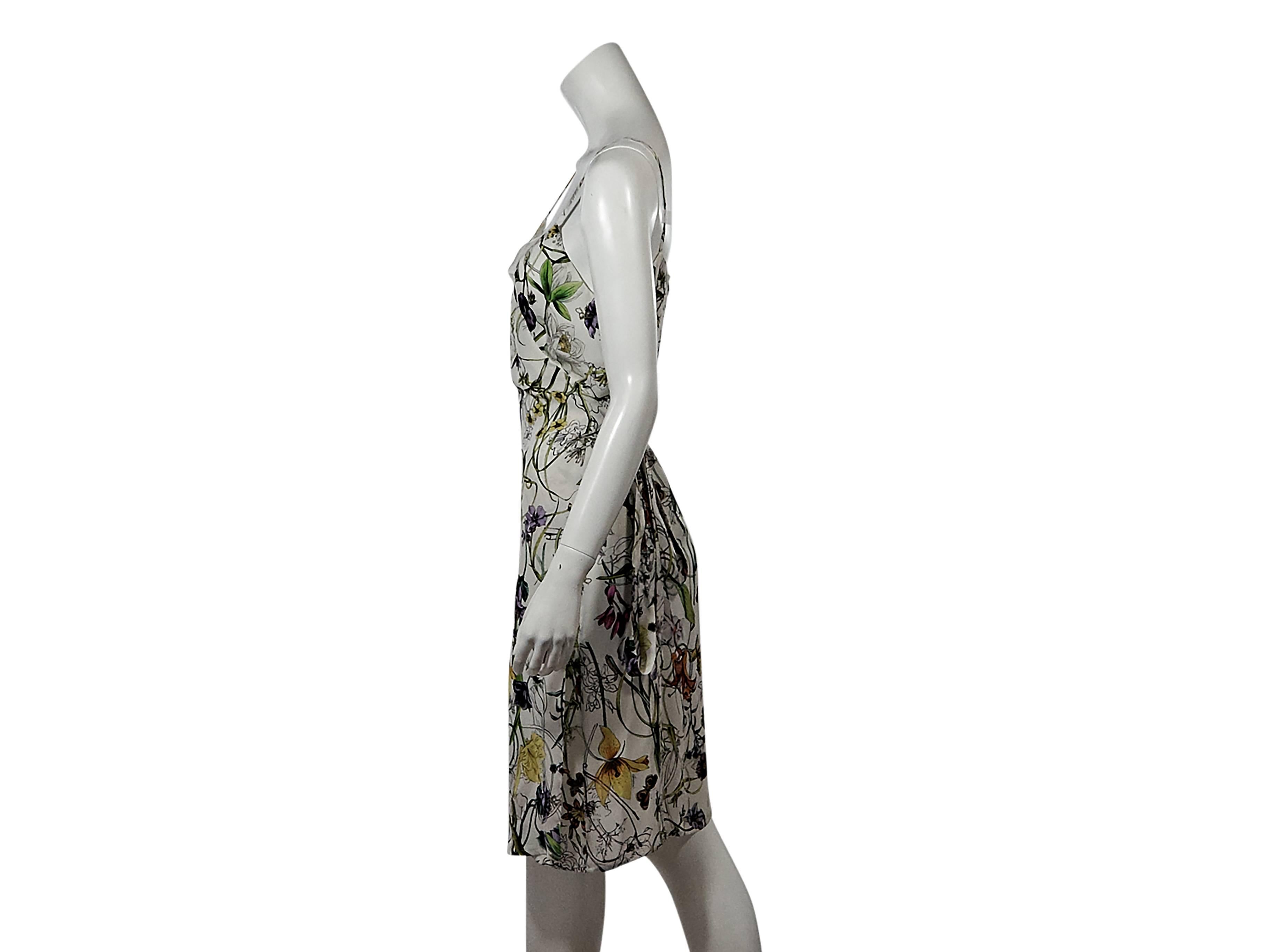 Product details:  Multicolor floral-print wrap dress by Gucci.  Sleeveless.  Adjustable tie waist closure.  Size 8
Condition: Pre-owned. New with tags.

Est. Retail $ 5,500.00
