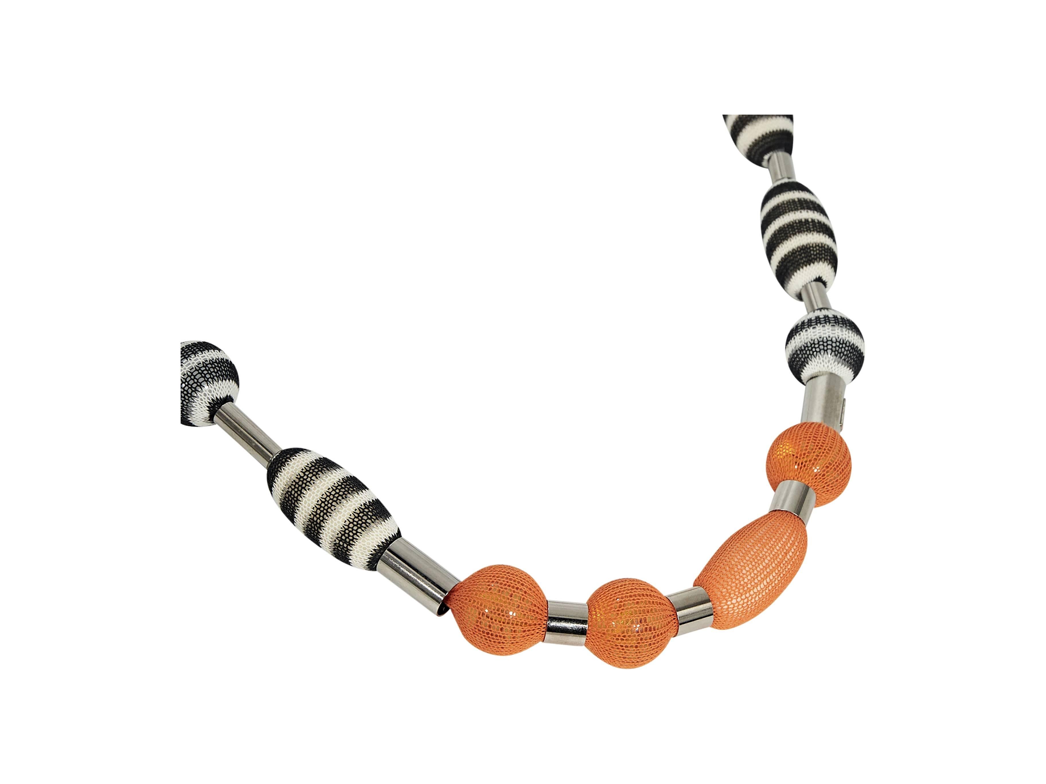 Product details:  Black and orange beaded necklace by Missoni.  Single stand design.  Adjustable lobster clasp closure.  Silvertone hardware. 
Condition: Pre-owned. Very good.

Est. Retail $ 378.00