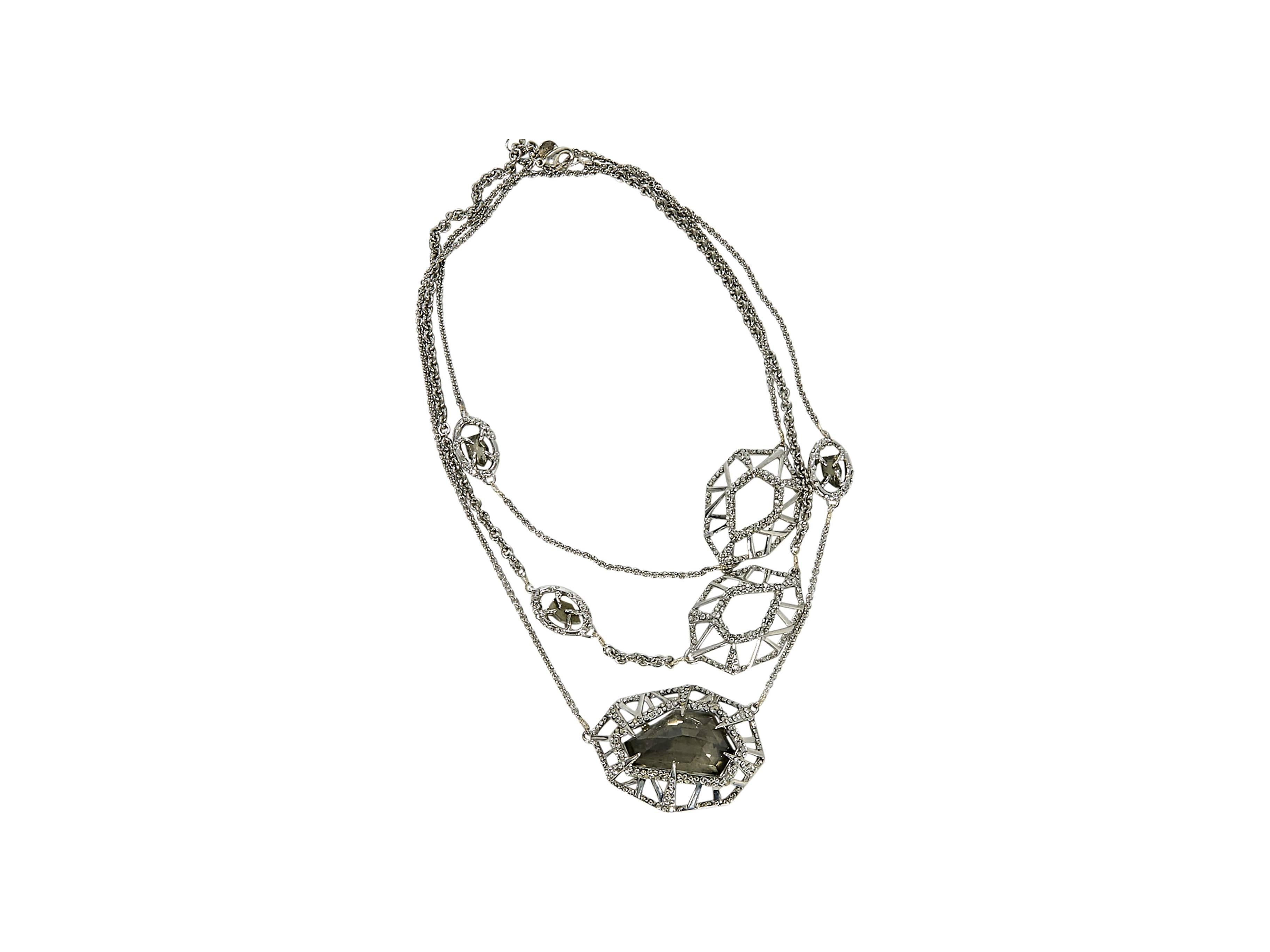 Product details:  Silvertone tiered necklace by Alexis Bittar.  Accented with faceted beads and charms.  Embellished with crystals.  Adjustable lobster clasp closure.  
Condition: Pre-owned. Very good.

Est. Retail $ 325.00
