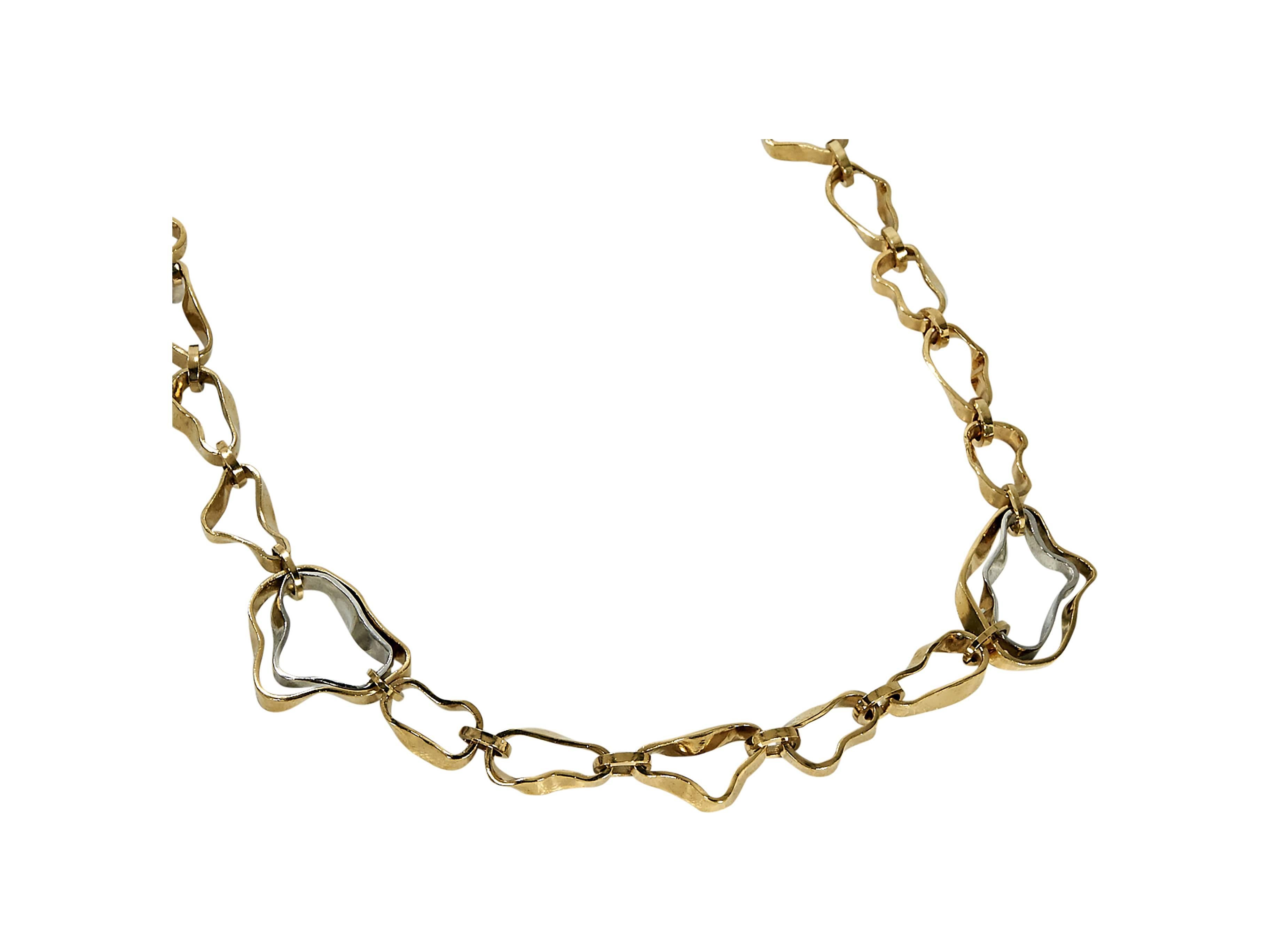 Product details:  Goldtone asymmetrical link necklace by Balenciaga.  Single strand design.  Hook closure.  
Condition: Pre-owned. Very good.

Est. Retail $ 875.00