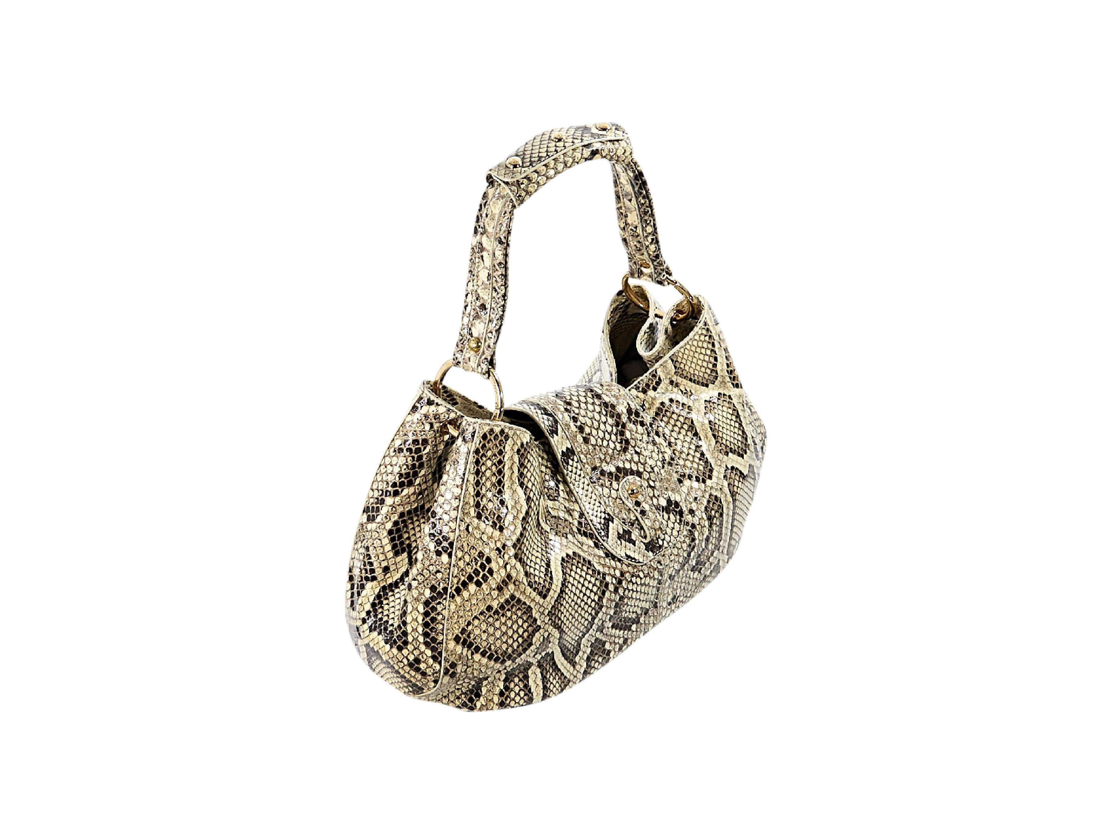 Product details:  Beige python hobo bag by Tod's.  Single shoulder strap.  Top strap with hook closure.  Lined interior with inner center zip compartment and slide and zip pockets.  Front flap pocket with magnetic snap closure.  Goldtone hardware. 