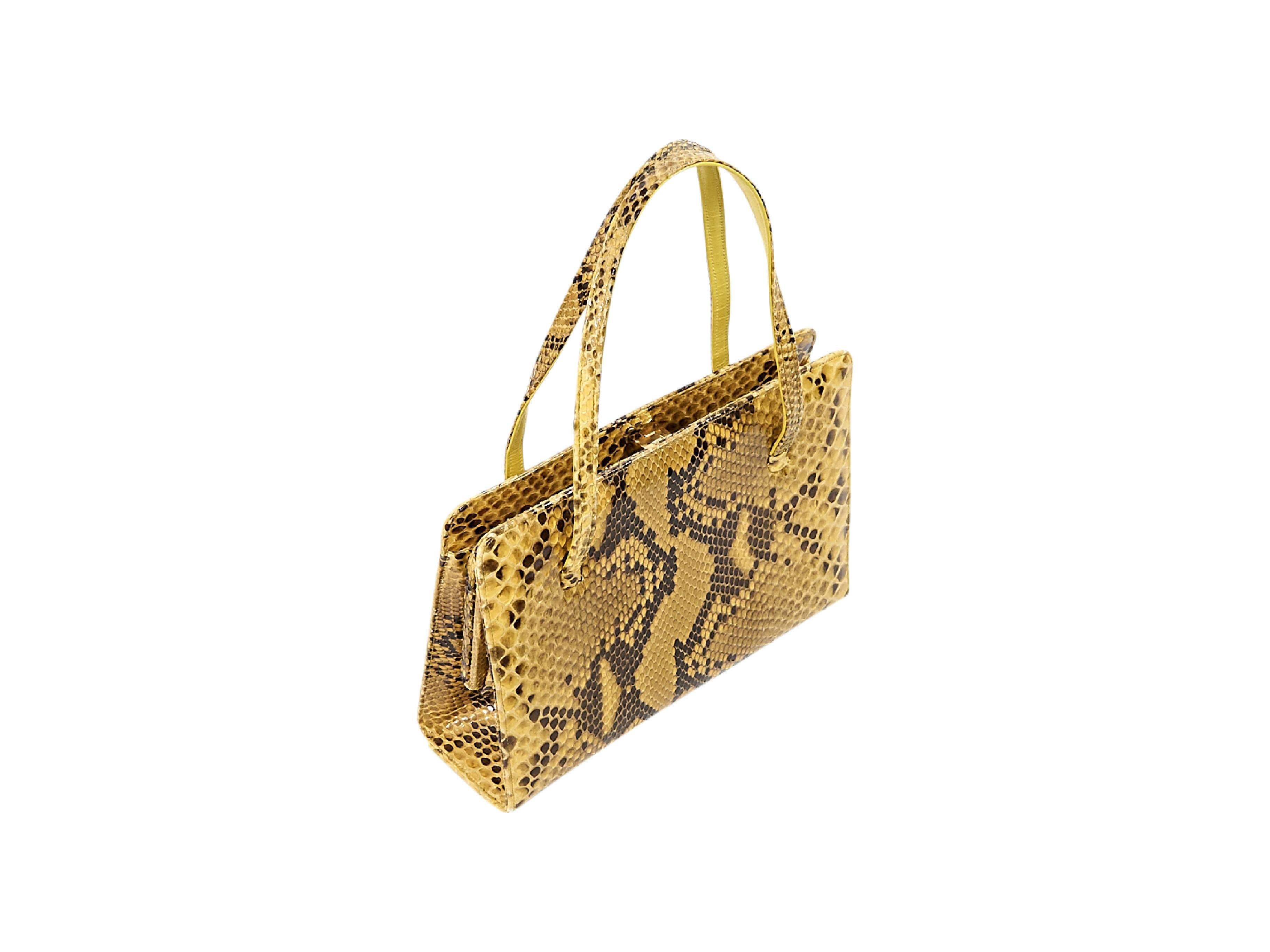 Product details:  Yellow alligator tote bag by Lambertson Truex.  Dual shoulder straps.  Top push-lock closure.  Lined interior with inner zip and slide pockets.  9