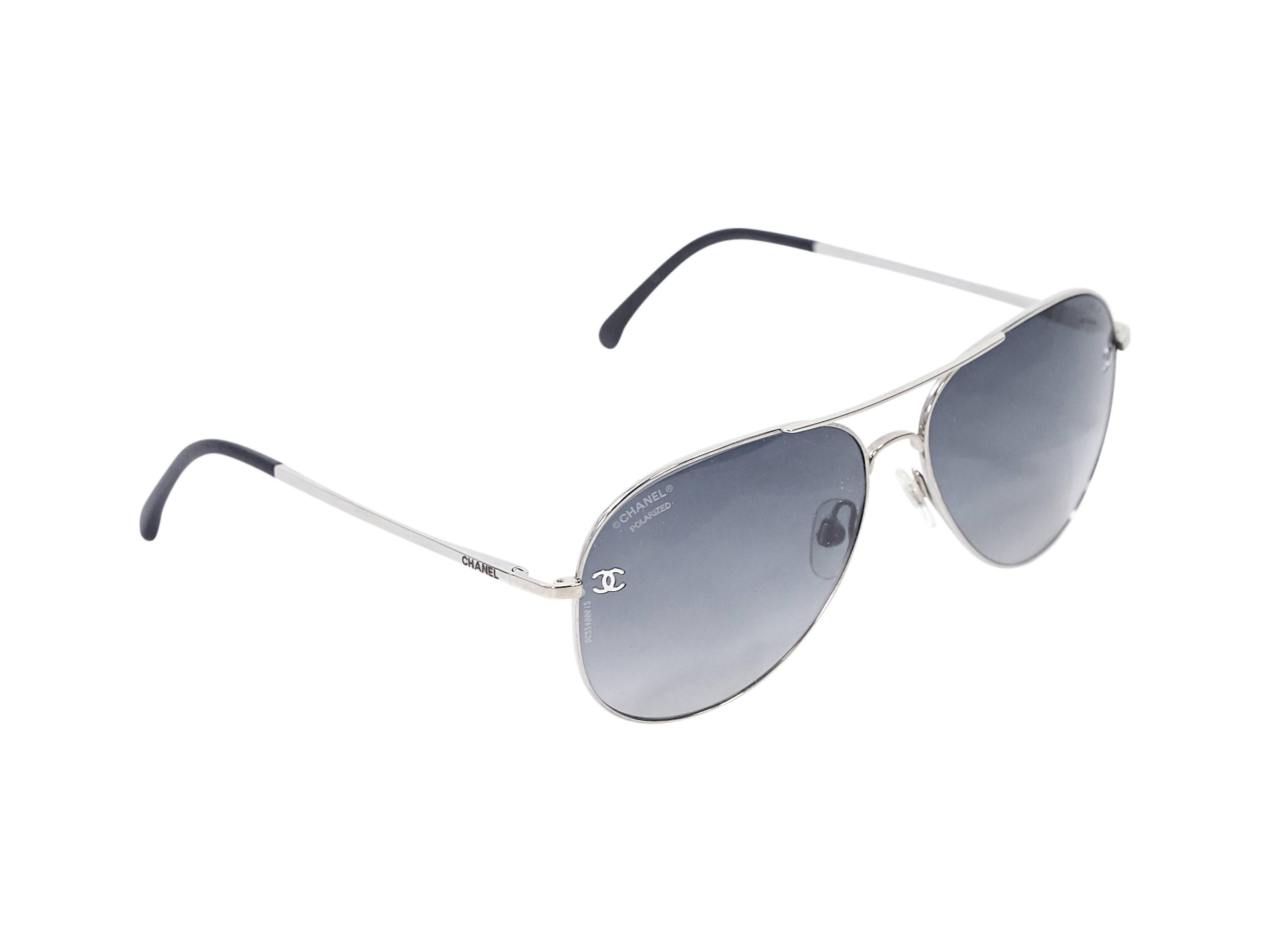 Product details:  Silvertone aviator sunglasses by Chanel.  Polarized, gradient lenses.  Cushioned nose pads.  Thin stems with logo detail at temples. 
Condition: Pre-owned. Very good.

Est. Retail $ 470.00
