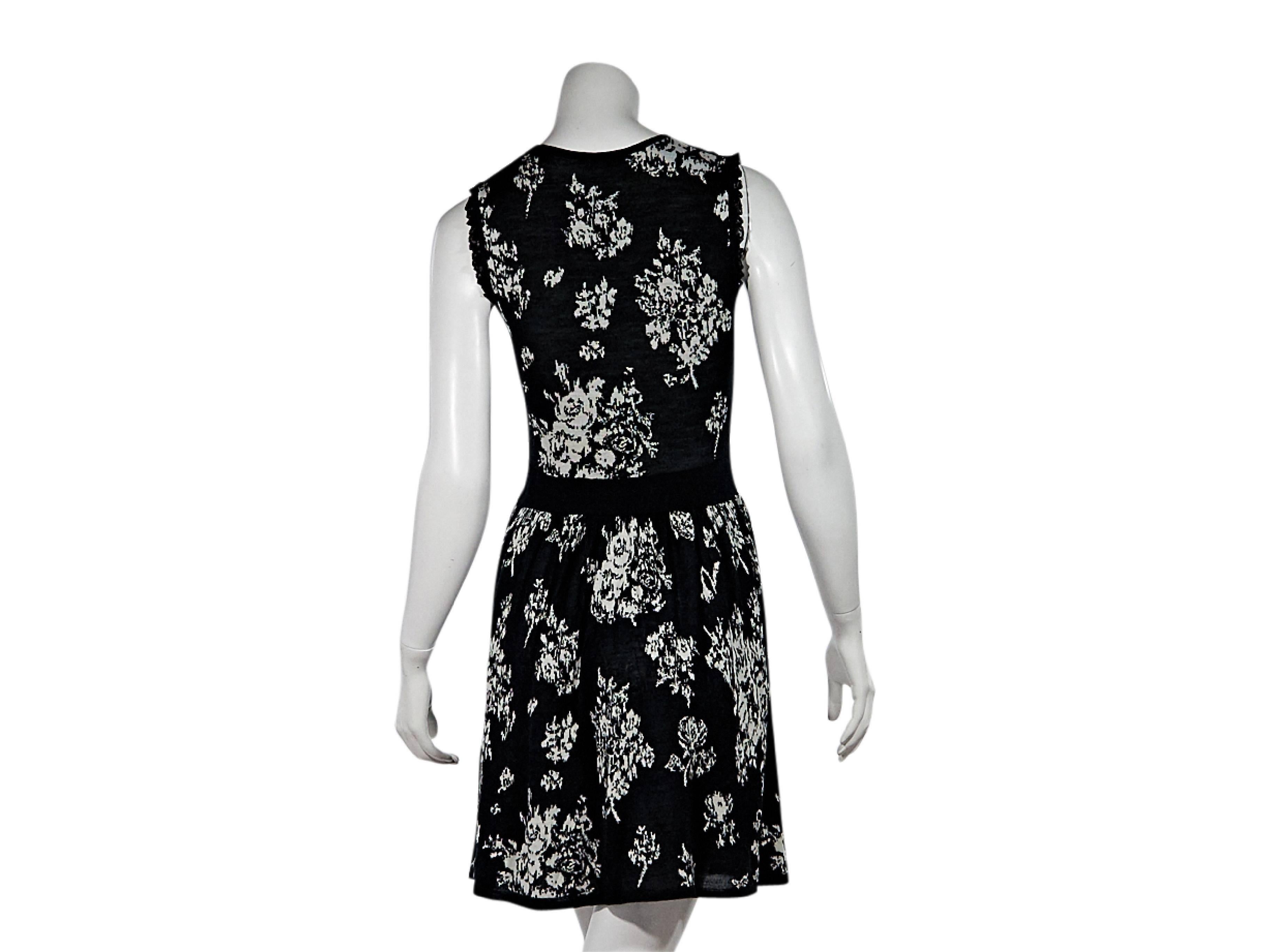 Product details:  Black and white floral knit dress by Red Valentino.  Crewneck.  Lace yoke.  Sleeveless.  Pullover style. Size S
Condition: Pre-owned. Very good.

Est. Retail $ 378.00