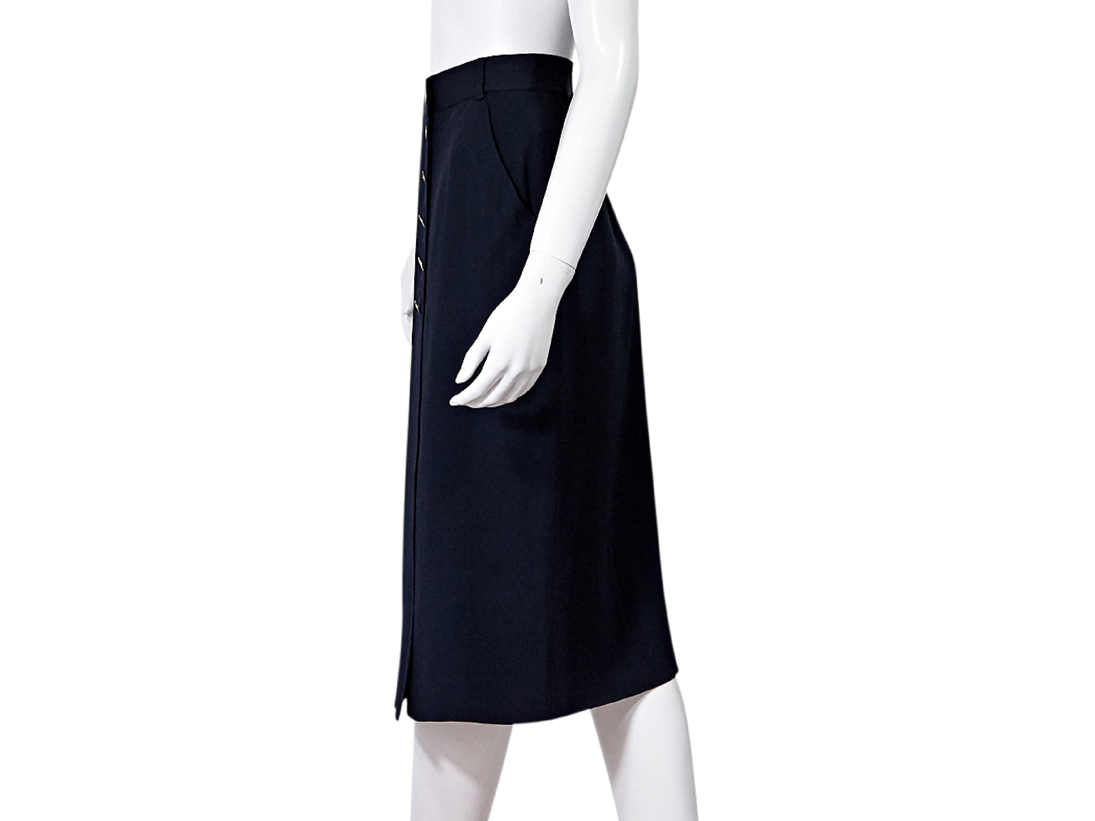 Product details:  Navy blue silk pencil skirt by Chanel.  Banded waist with belt loops.  Button-front closure. Size M
Condition: Pre-owned. Very good.

Est. Retail $ 898.00
