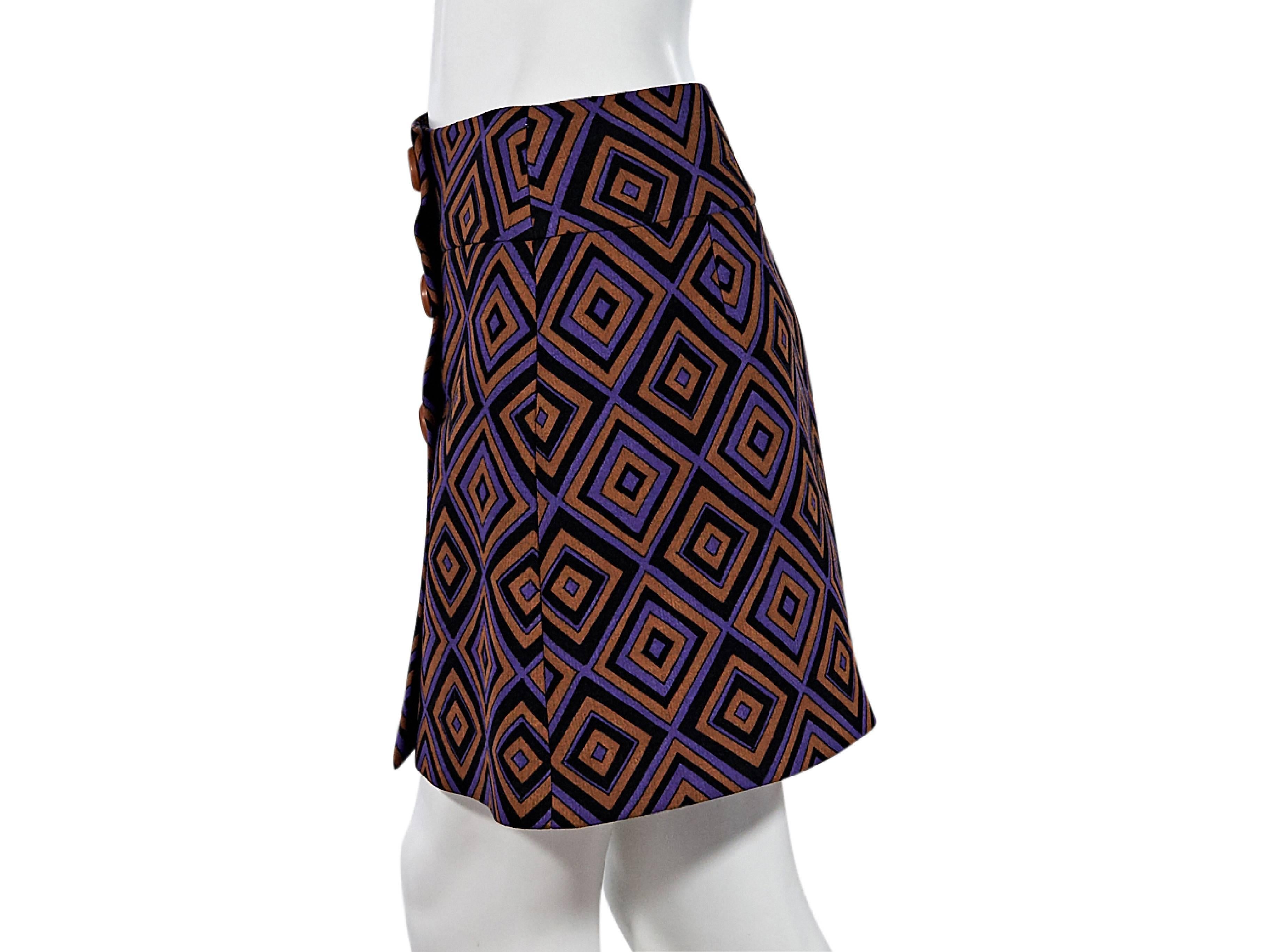 Product details:  Multicolor abstract-printed virgin wool mini skirt by Prada.  Wide banded waist.  Button-front closure.  Size 2
Condition: Pre-owned. Very good.

Est. Retail $ 598.00