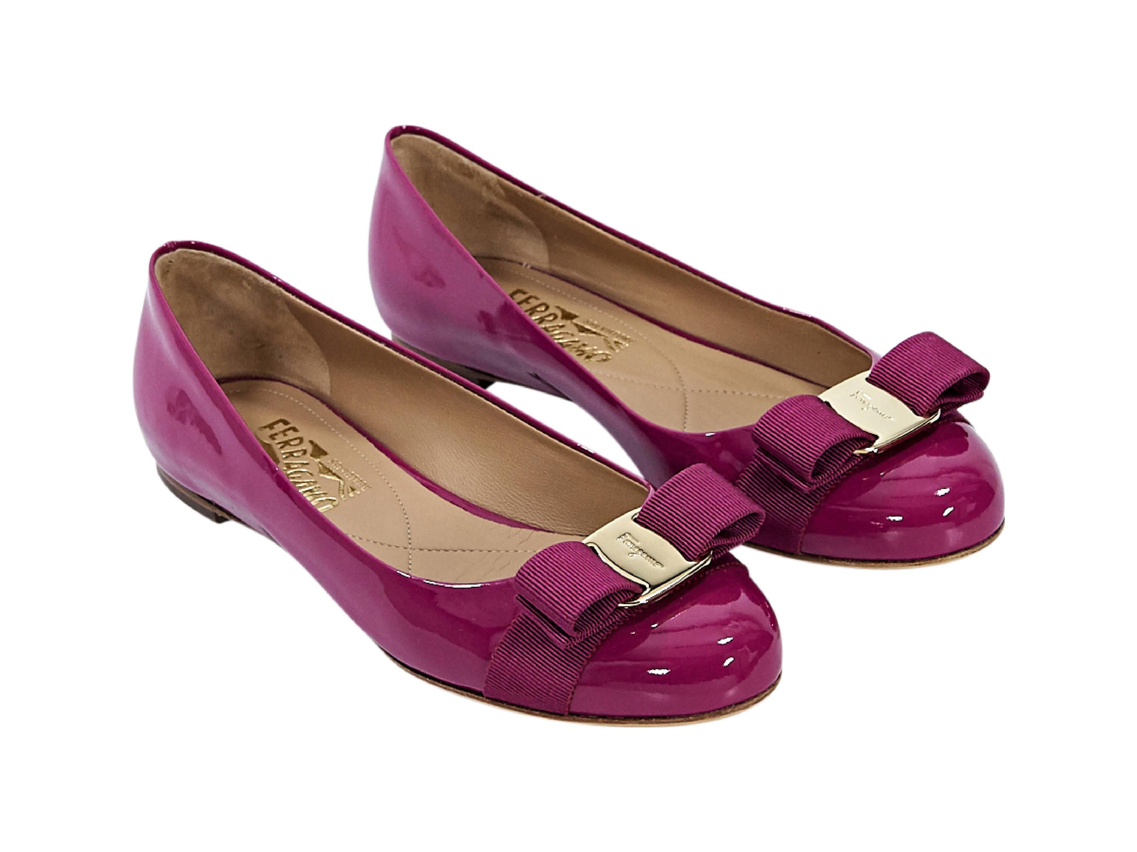 Product details:  Magenta patent leather Vara ballet flats by Salvatore Ferragamo.  Grosgrain bow accents vamp.  Round toe.  Slip-on style. Size 7
Condition: Pre-owned. Very good.

Est. Retail $ 595.00