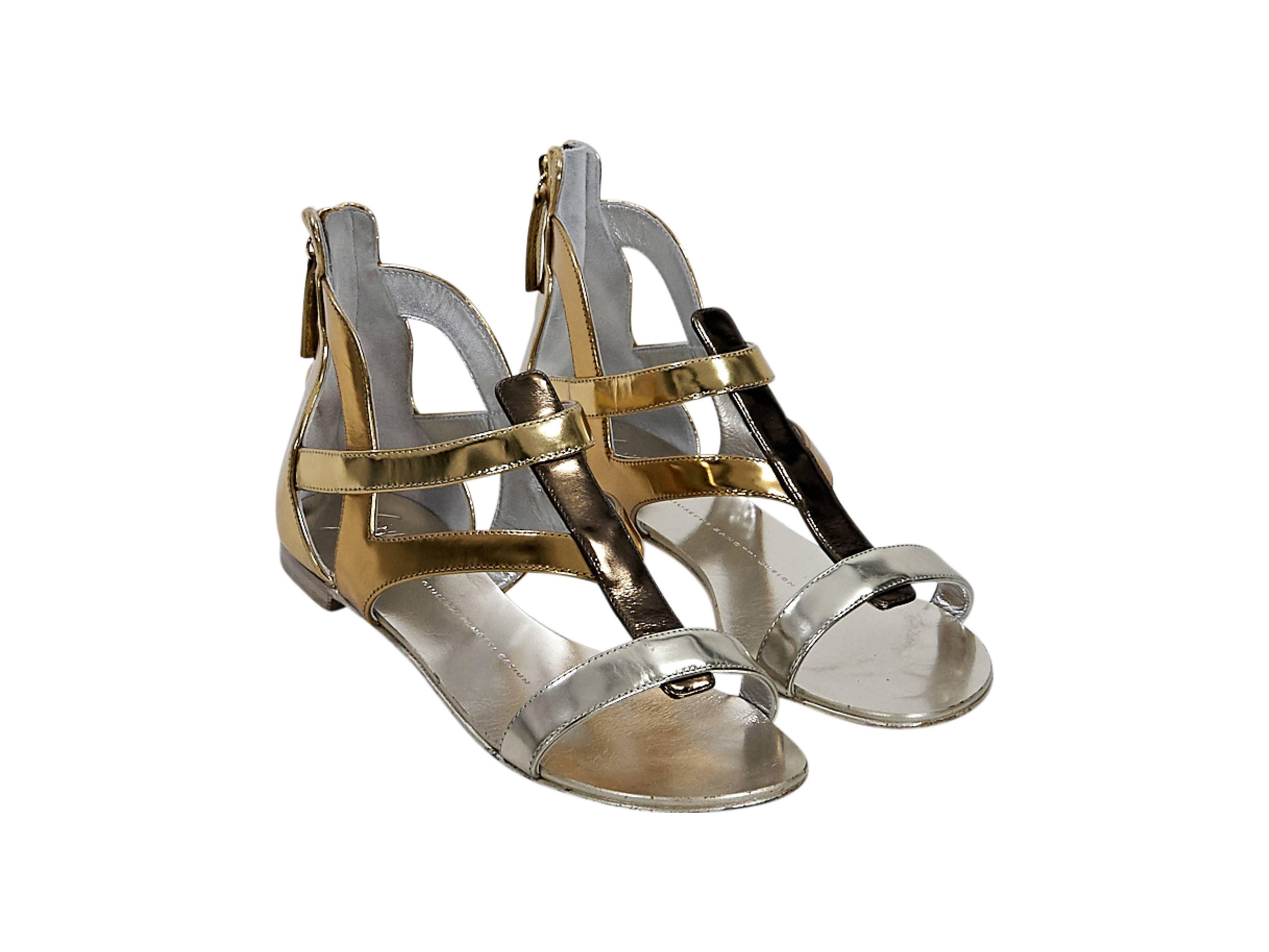 Product details:  Multicolor metallic leather gladiator sandals by Giuseppe Zanotti.  Open toe.  Back zip closure.  Size 7
Condition: Pre-owned. Very good.

Est. Retail $ 598.00

