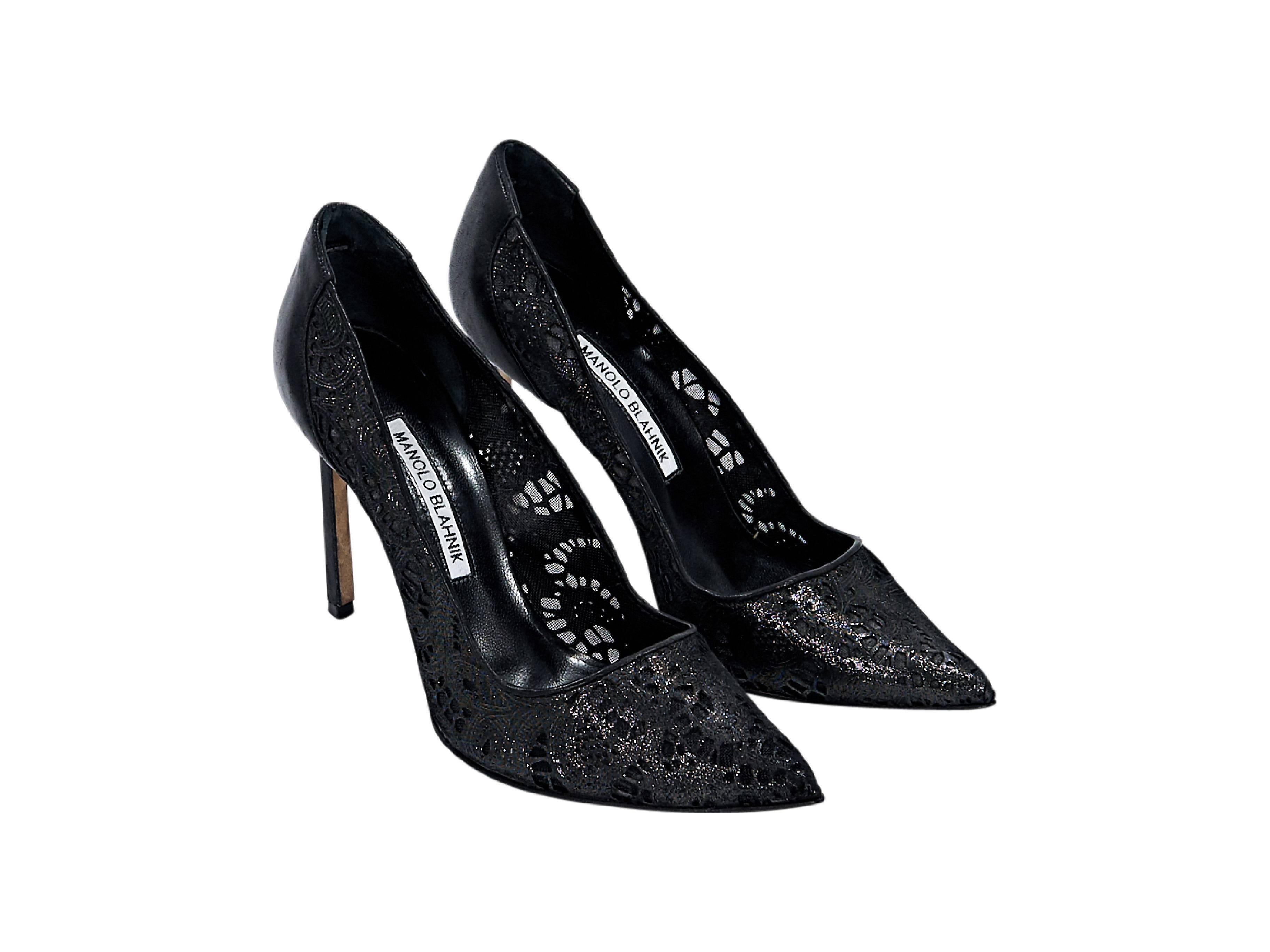 Product details:  Black leather and lace pumps by Manolo Blahnik.  Point toe.  Slip-on style. Size 8 
Condition: Pre-owned. Very good.

Est. Retail $ 795.00