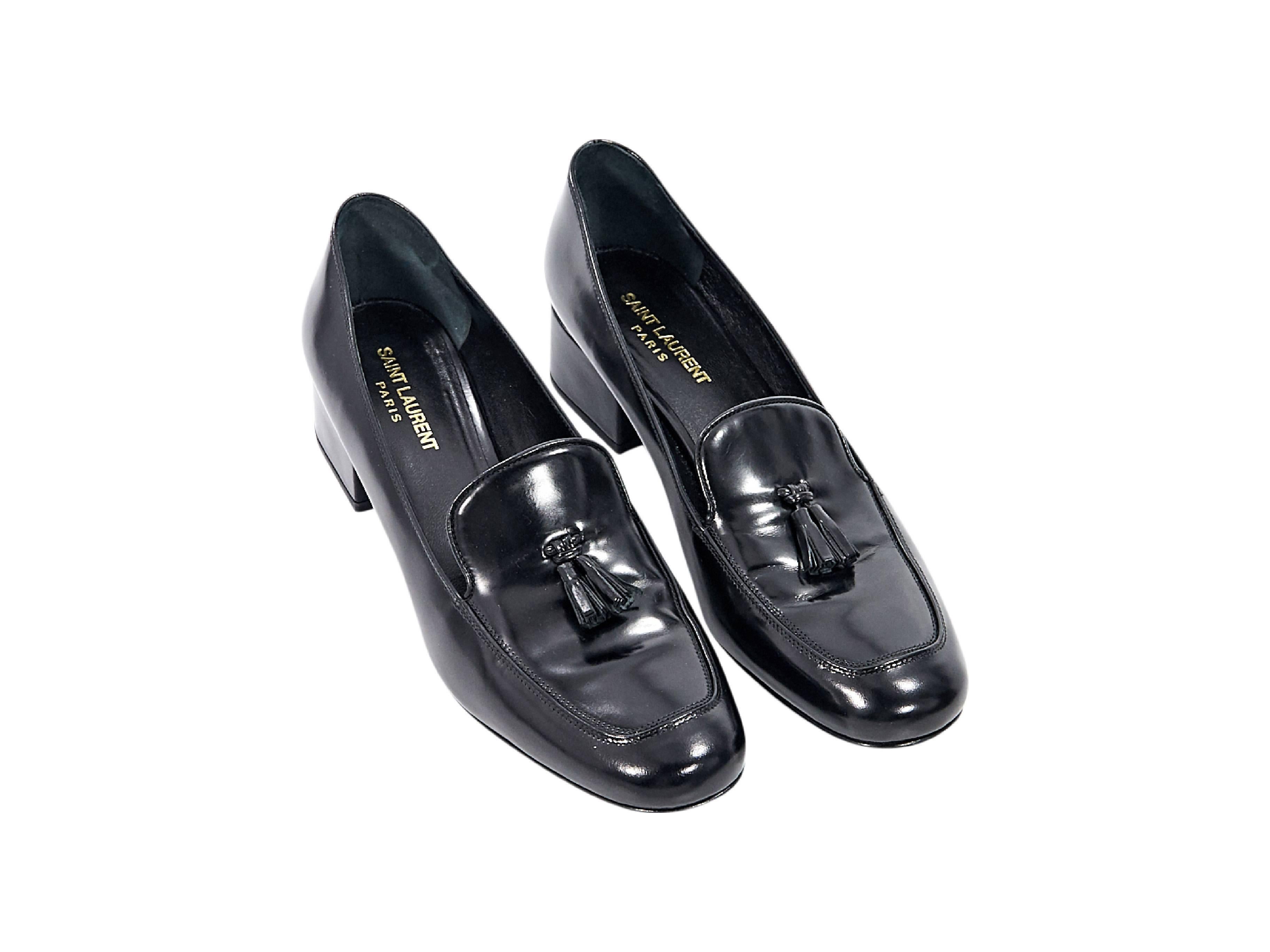 Product details:  Black leather Montaigne loafers by Yves Saint Laurent.  Accented with tassels.  Round moc toe.  Low block heel.  Slip-on style. Size 10
Condition: Pre-owned. Very good.

Est. Retail $ 795.00

