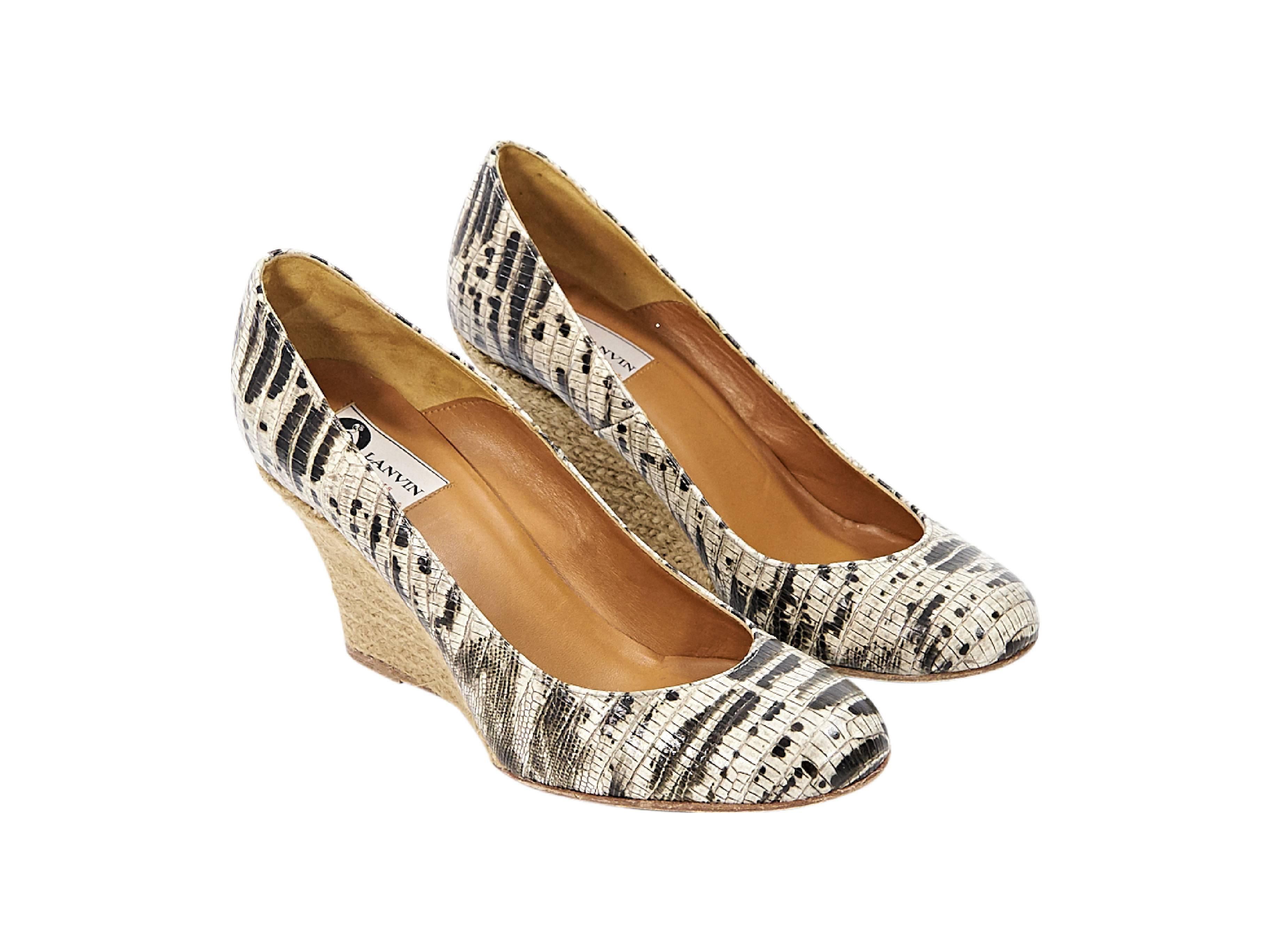 Product details:  Beige snake-embossed leather espadrille wedges by Lanvin.  Round toe.  Braided jute covers wedge.  Slip-on style. Size 8
Condition: Pre-owned. Very good.

Est. Retail $ 428.00
