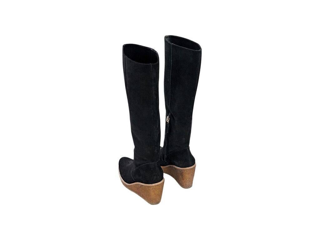 Product details:  Black suede tall boots by Vince Camuto.  Inner half zip closure.  Round toe.  Cork wedge design.  
Condition: Pre-owned. Very good.
Est. Retail $ 595.00