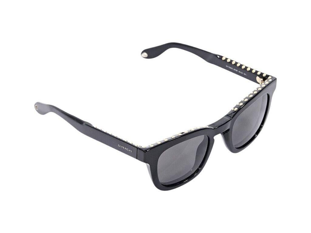 Product details:  Black square sunglasses by Givenchy.  Embellished with studs.  Goldtone hardware. 
Condition: Pre-owned. Very good.
Est. Retail $ 898.00