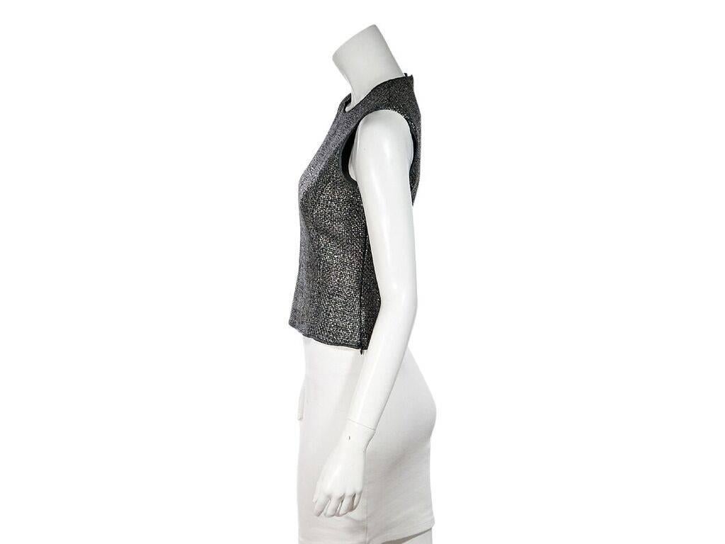 Product details:  Metallic silver woven top by Miu Miu.  Roundneck.  Sleeveless.  Concealed back zip closure. 
Condition: Pre-owned. Very good.  
Est. Retail $ 498.00