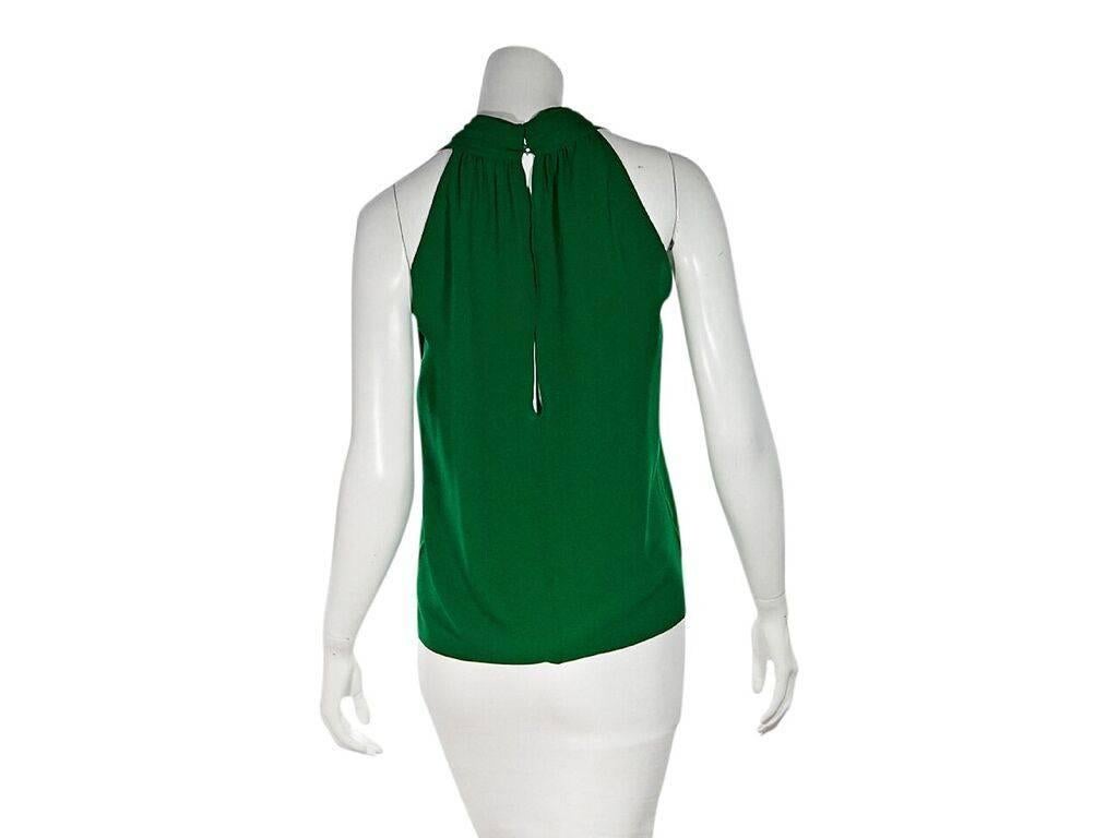 Product details:  Green silk tank top by Gucci.  Deep u-neck.  Sleeveless.  Concealed back button closure with keyhole cutouts.  Label size IT 42.
Condition: Pre-owned. Very good.  
Est. Retail $ 378.00