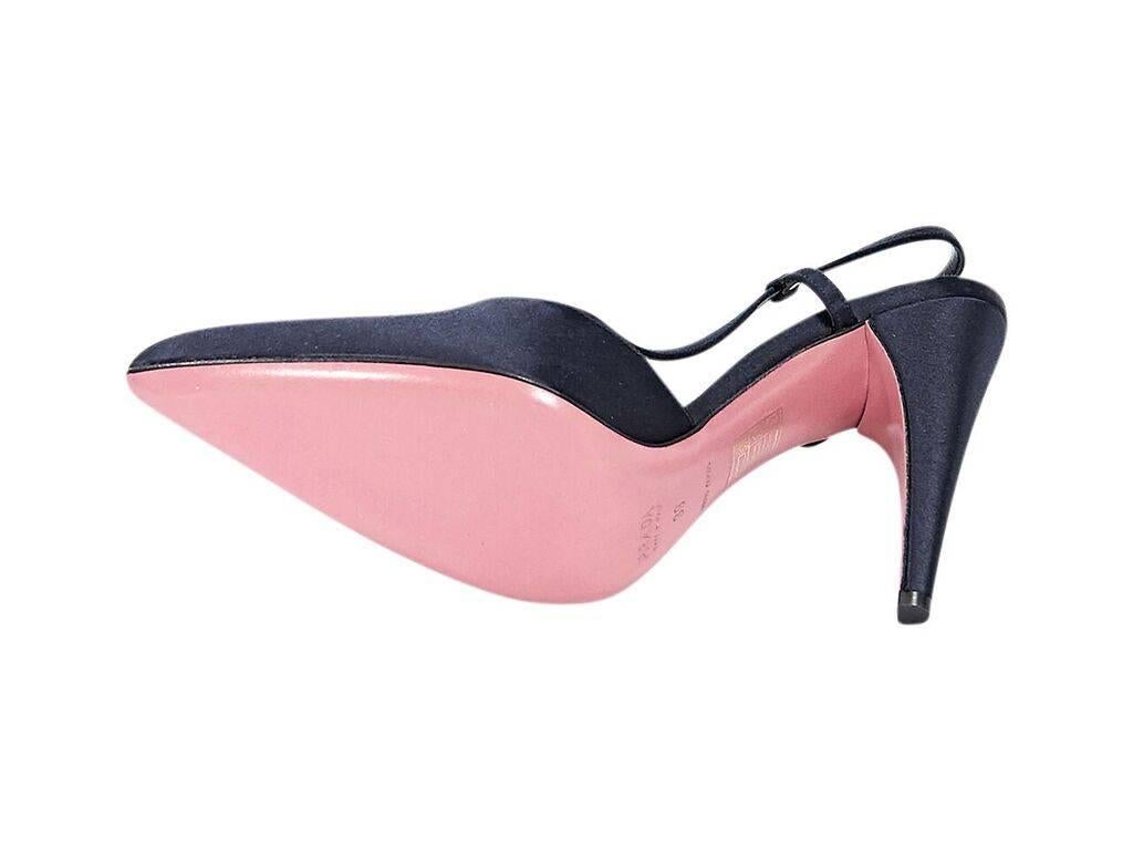 Product details:  Black satin slingback pumps by Prada.  Adjustable slingback strap.  Point toe. 
Condition: Pre-owned. Excellent.
Est. Retail $ 428.00