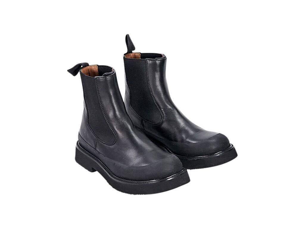 Product details:  Black leather Chelsea boots by Céline.  Elasticized side panels for an easy fit.  Round toe.  Pull-on style. 
Condition: Pre-owned. Very good.
Est. Retail $ 1,028.00