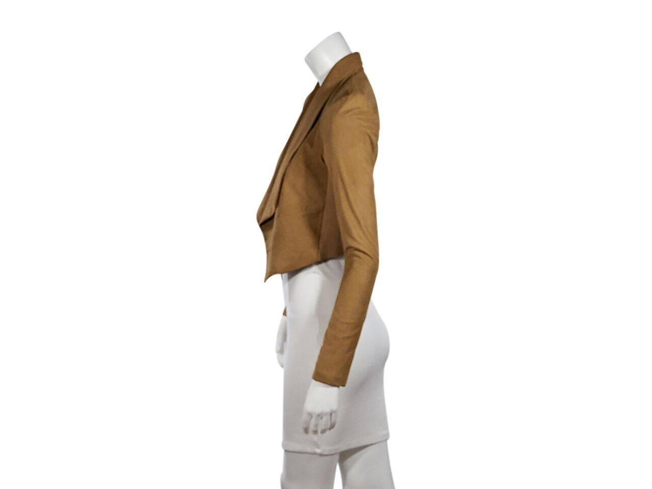 Product details:  Tan suede jacket by Alice + Olivia.  Long sleeves.  Draped open front.  
Condition: Pre-owned. New with tags.
Est. Retail $ 898.00