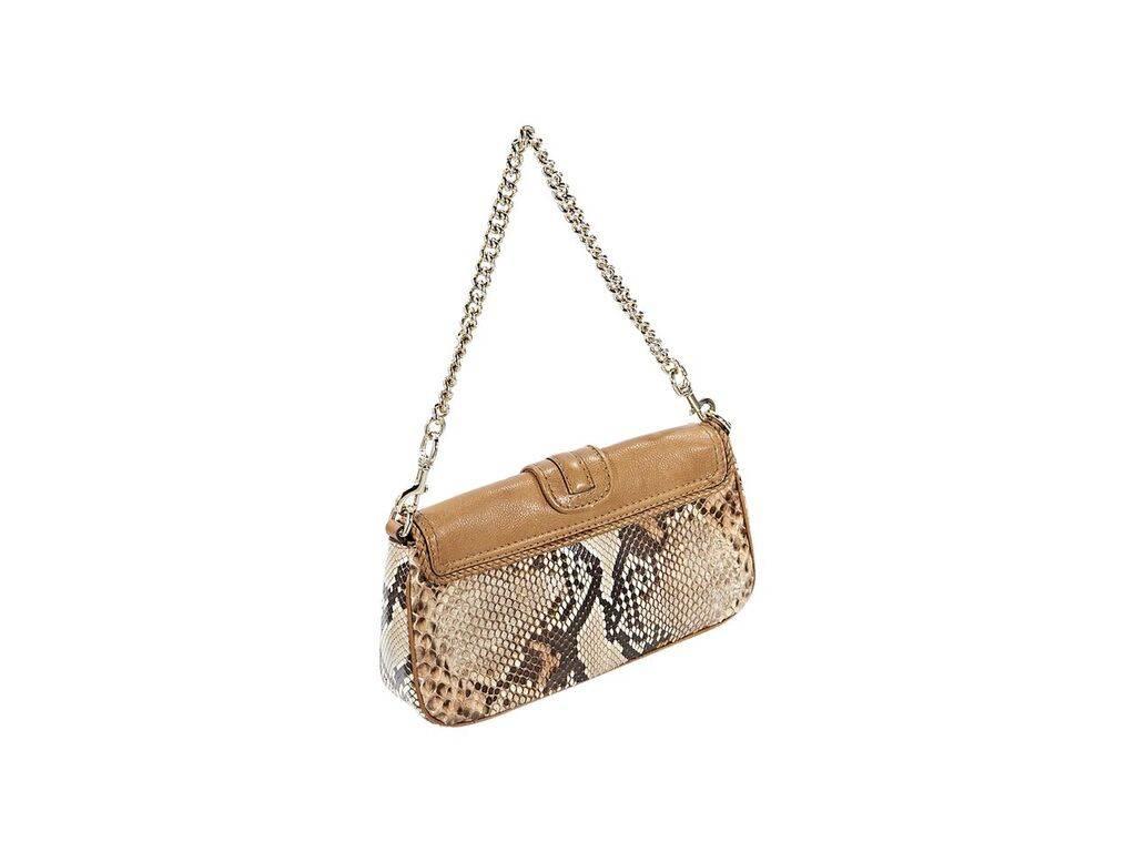 Product details:  Brown python Marrakech shoulder bag by Gucci.  Detachable chain shoulder strap.  Leather front flap with braided tassels.  Magnetic snap closure.  Lined interior with inner slide pocket.  Goldtone hardware.  Dust bag included. 