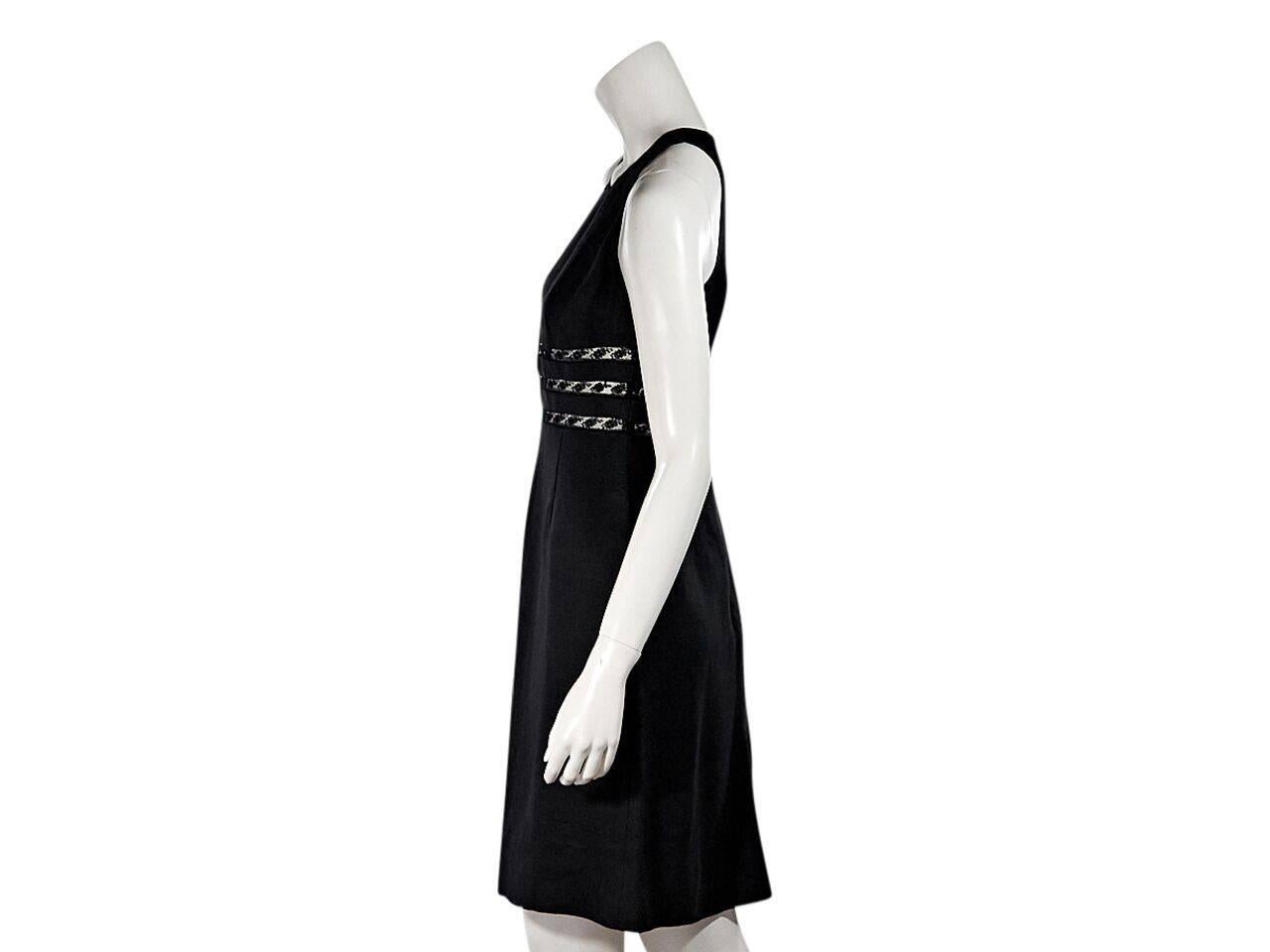 Product details:  Black lace-trimmed sheath dress by Valentino.  Roundneck.  Sleeveless.  Concealed back zip closure.  Designer size 40. bust is 28