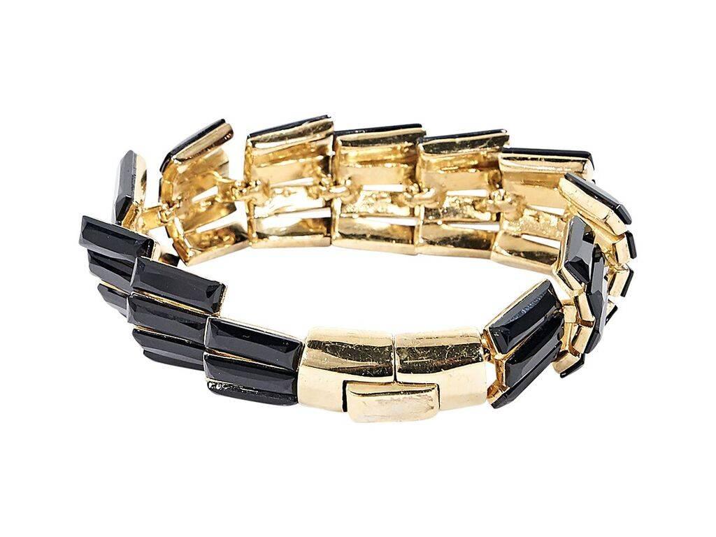 Product details:  Black enamel bracelet by Giuseppe Zanotti.  Push clasp closure.  Goldtone hardware. 
Condition: Pre-owned. Very good.
Est. Retail $ 375.00