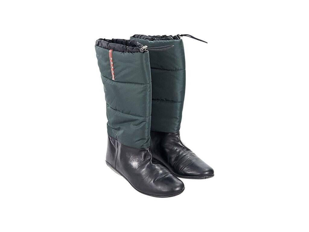 Product details:  Green and black winter boots by Prada Sport.  Top drawstring closure.  Round toe.  Pull-on style. 
Condition: Pre-owned. Very good.
Est. Retail $ 398.00