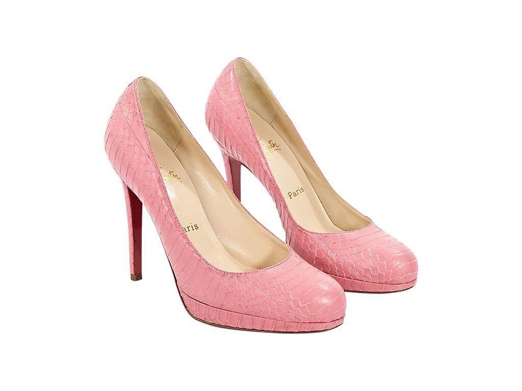 Product details: Pink embossed leather platform pumps by Christian Louboutin.  Round toe.  Iconic red sole.  Slip-on style. 
Condition: Pre-owned. Very good.
Est. Retail $ 995.00