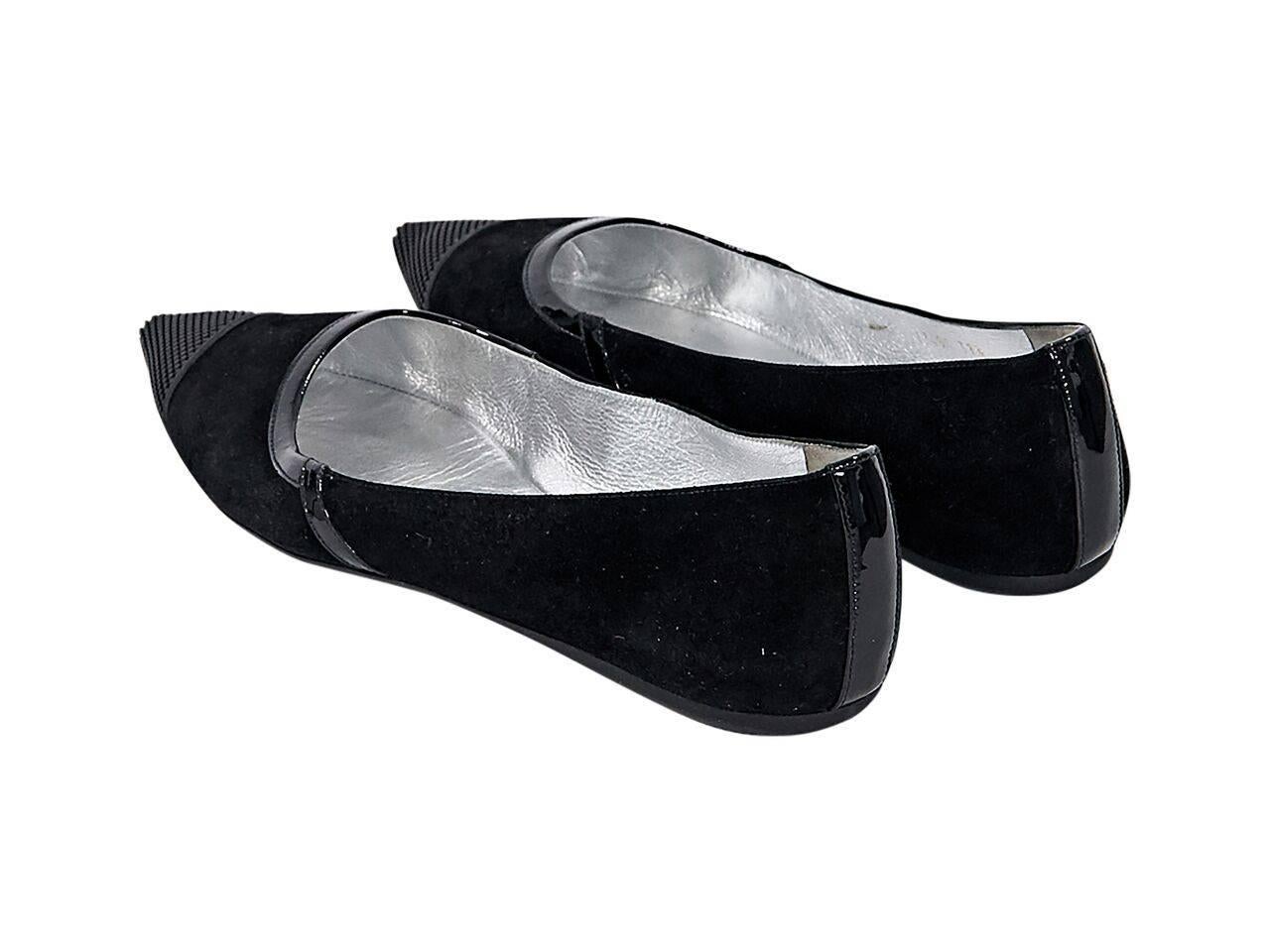 Product details:  Black suede flats by Prada.  Trimmed with patent leather.  Rubber point toe.  Slip-on style. 
Condition: Pre-owned. Very good.
Est. Retail $ 435.00