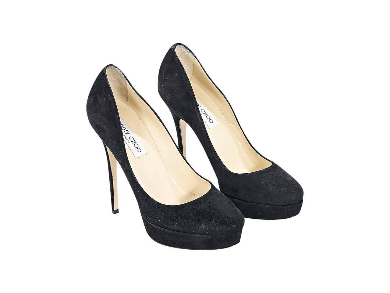 Product details:  Black suede platform pumps by Jimmy Choo.  Towering stiletto and platform design.  Almond toe.  Slip-on style.
Condition: Pre-owned. Very good.
Est. Retail $ 828.00