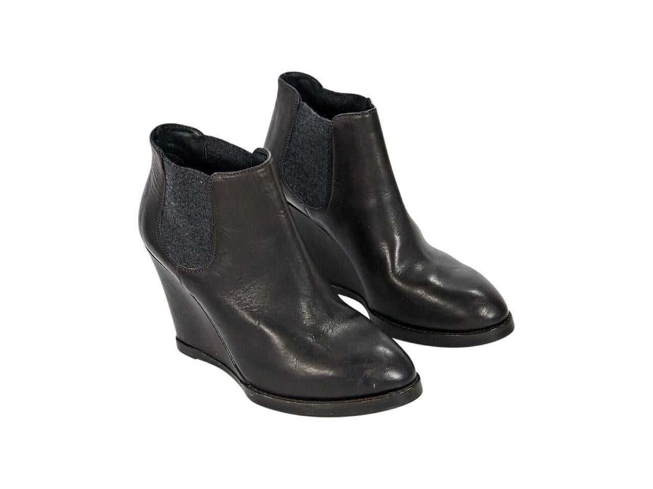 Product details:  Brown leather wedge Chelsea boots by Brunello Cucinelli.  Elasticized side panels for an easy fit.  Round almond toe.  Pull-on style. 
Condition: Pre-owned. Very good.
Est. Retail $ 1,705.00