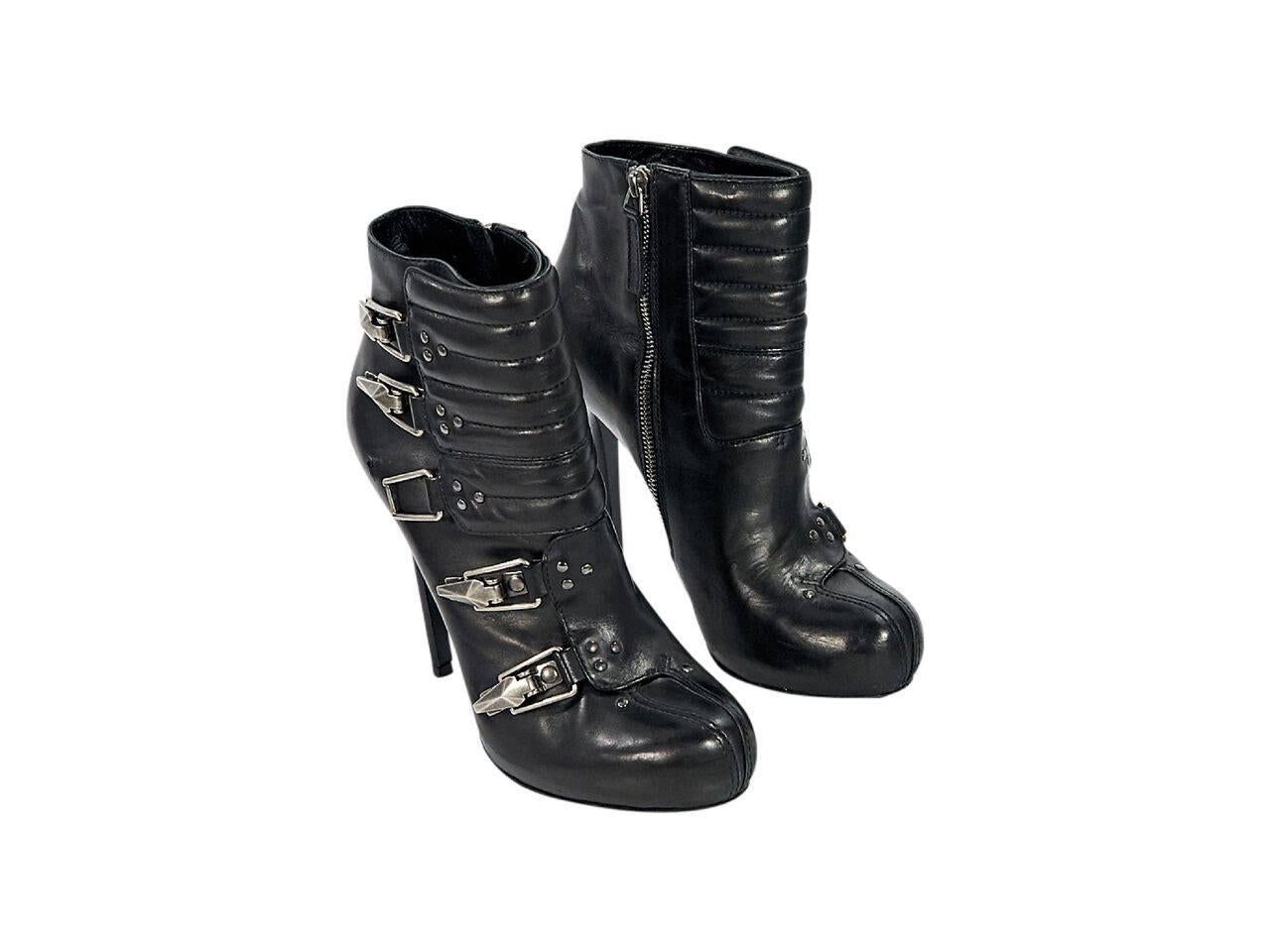 Product details:  Black leather ankle boots by Alexander McQueen.  Multiple buckle strap details.  Inner zip closure.  Concealed platform.  Silvertone hardware.
Condition: Pre-owned. Very good.
Est. Retail $ 1,198.00
