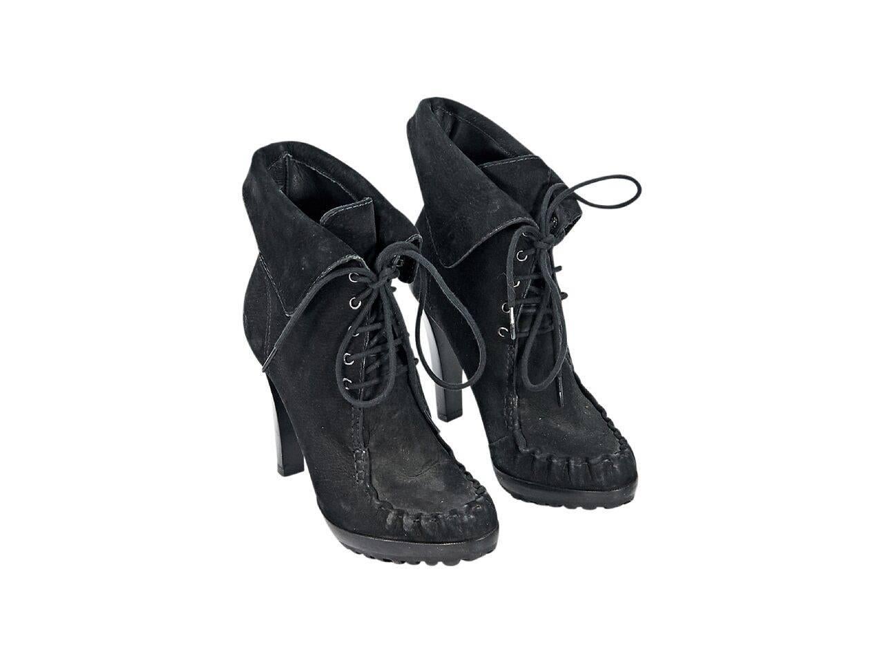 Product details:  Black oiled suede ankle boots by Diane von Furstenberg.  Lace-up closure.  Round moc toe.  Stacked heel and platform design. 
Condition: Pre-owned. Very good.
Est. Retail $ 598.00