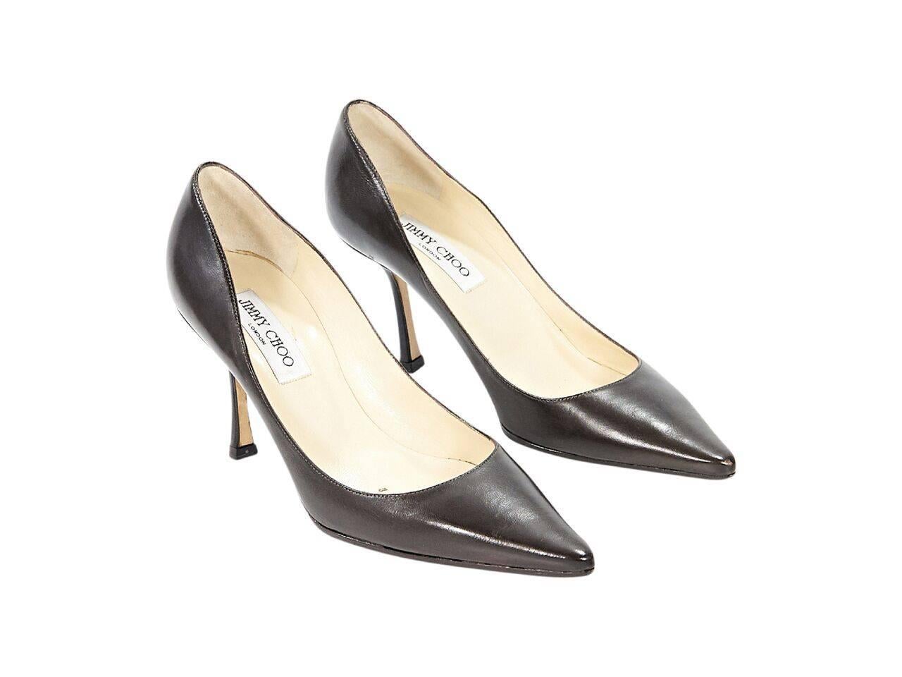 Product details:  Brown leather pumps by Jimmy Choo.  Point toe.  Slip-on style.  
Condition: Pre-owned. Very good.
Est. Retail $ 398.00
