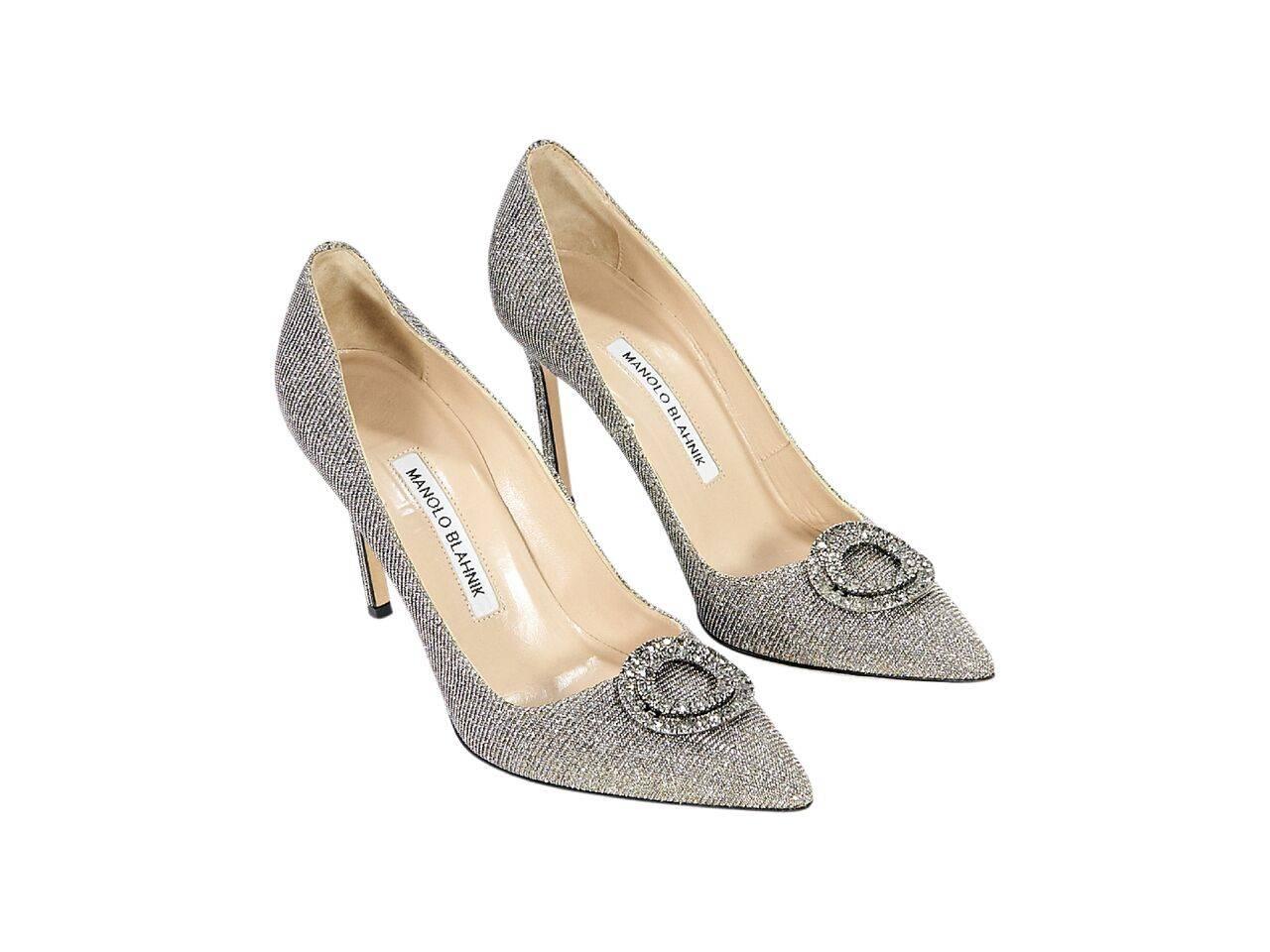 Product details:  Metallic silver embellished pumps by Manolo Blahnik.  Point toe.  Slip-on style.  
Condition: Pre-owned. Very good.
Est. Retail $ 698.00