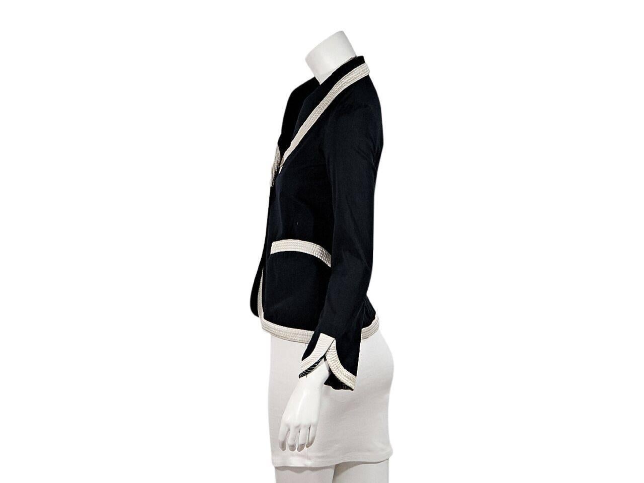 Product details:  Black blazer by Louis Vuitton.  Topstitched white trim.  Long sleeves.  Button-front closure.  Waist patch pockets.  
Condition: Pre-owned. Very good.
Est. Retail $ 1,048.00