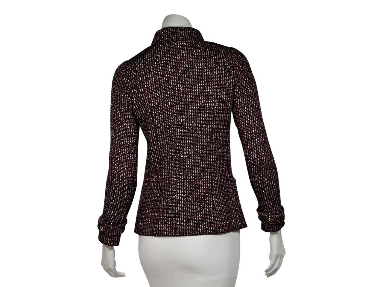 Product details:  Multicolor boucle jacket by Chanel.  From the 2012.  Stand collar.  Long sleeves.  Button-front closure.  Waist slide pockets.  Princess seams create a flattering silhouette.  Label size FR 36.
Condition: Pre-owned. Very good.
Est.