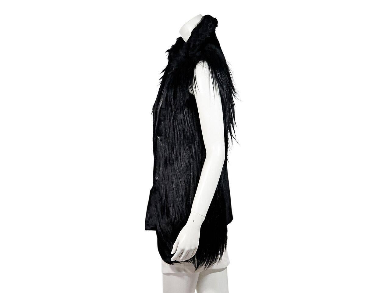 Product details:  Black lamb fur vest by Adrienne Landau.  Spread collar.  Concealed asymmetrical zip closure.  Waist zip pockets.  
Condition: Pre-owned. Very good.
Est. Retail $ 925.00