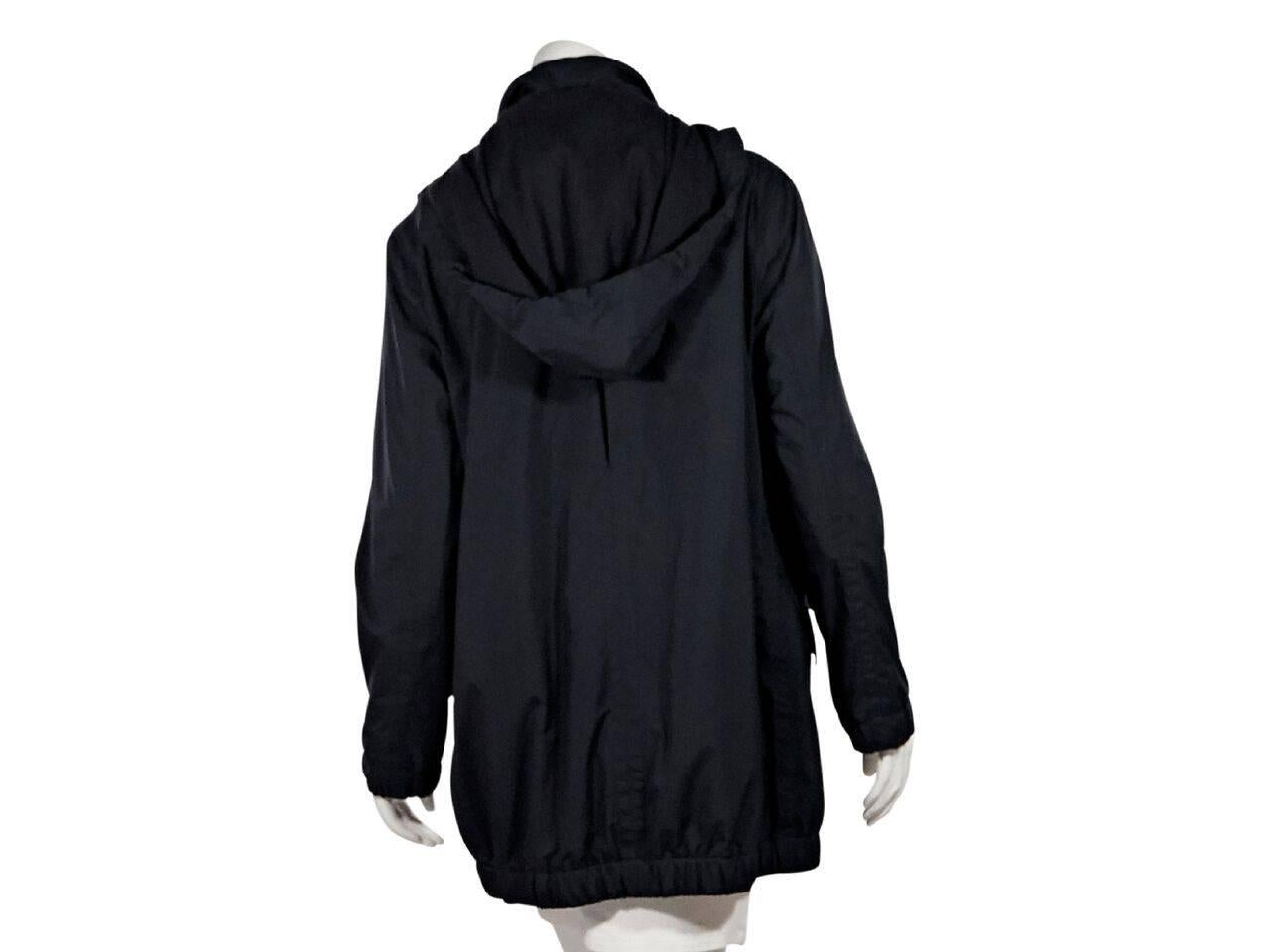 Product details:  Black cashmere-lined jacket by Loro Piana.  Stand collar.  Detachable hood.  Long sleeves.  Zip-front closure.  Waist flap pockets.  Elasticized hem. 
Condition: Pre-owned. Very good.
Est. Retail $ 1,395.00